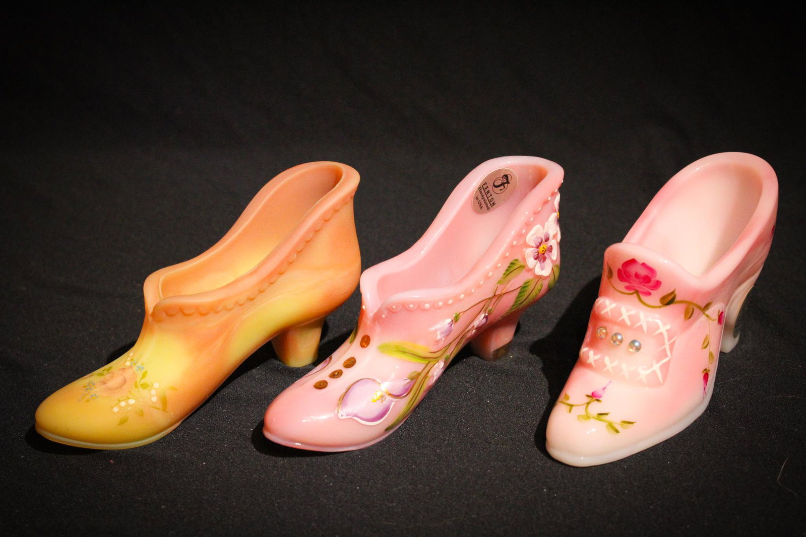 3 pc Lot Fenton Glass Shoes: Now these are sort of special wouldn't you say? Three Fenton Glass shoes in Burmese, Rosalene and hand painted. Lovely. Tallest measures 2 1/2" tall.
