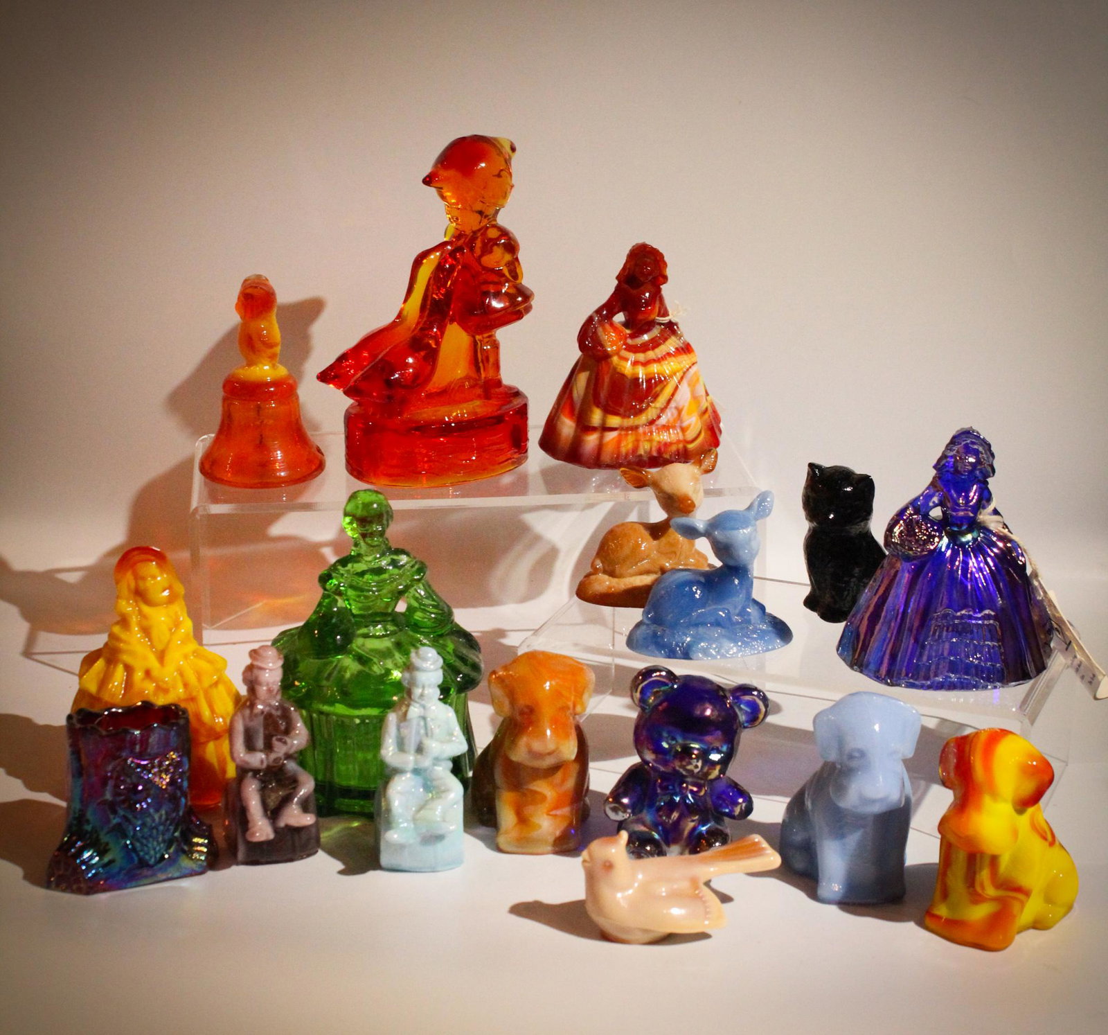 17 pc Lot Mosser & Boyd Glass Figurines: A 17 piece lot of Mosser and Boyd glass figurines including ladies, dogs, clown, cat and more. Everything a lonely person could want to fill their house! Tallest measures 6" tall.