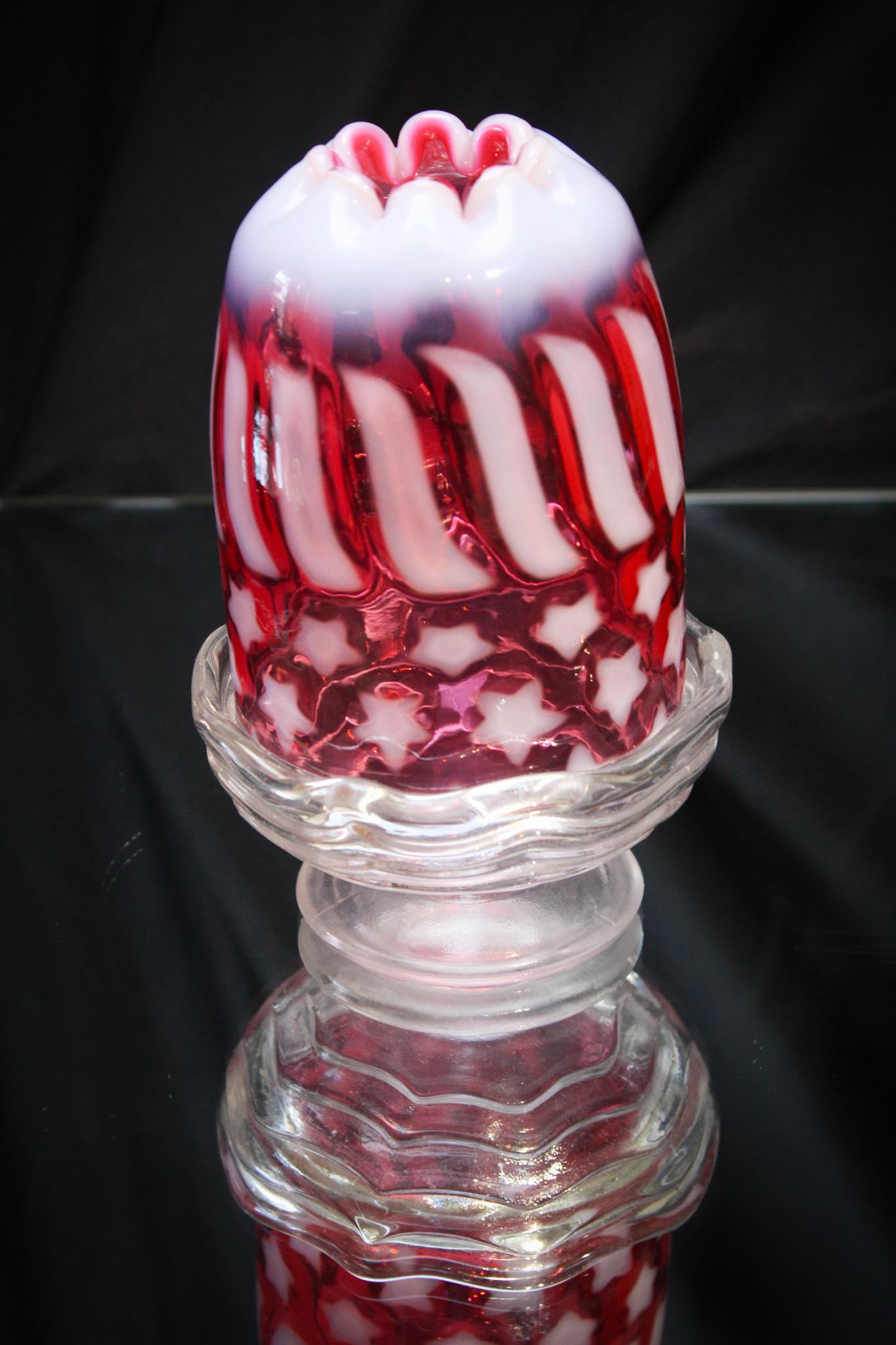 Fenton Cranberry Opalescent Fairy Lamp: How Patriotic is this? Boy we definitely need some of that in today's world right? Great color and opalescence to the glass. Measures 5 1/2" tall.