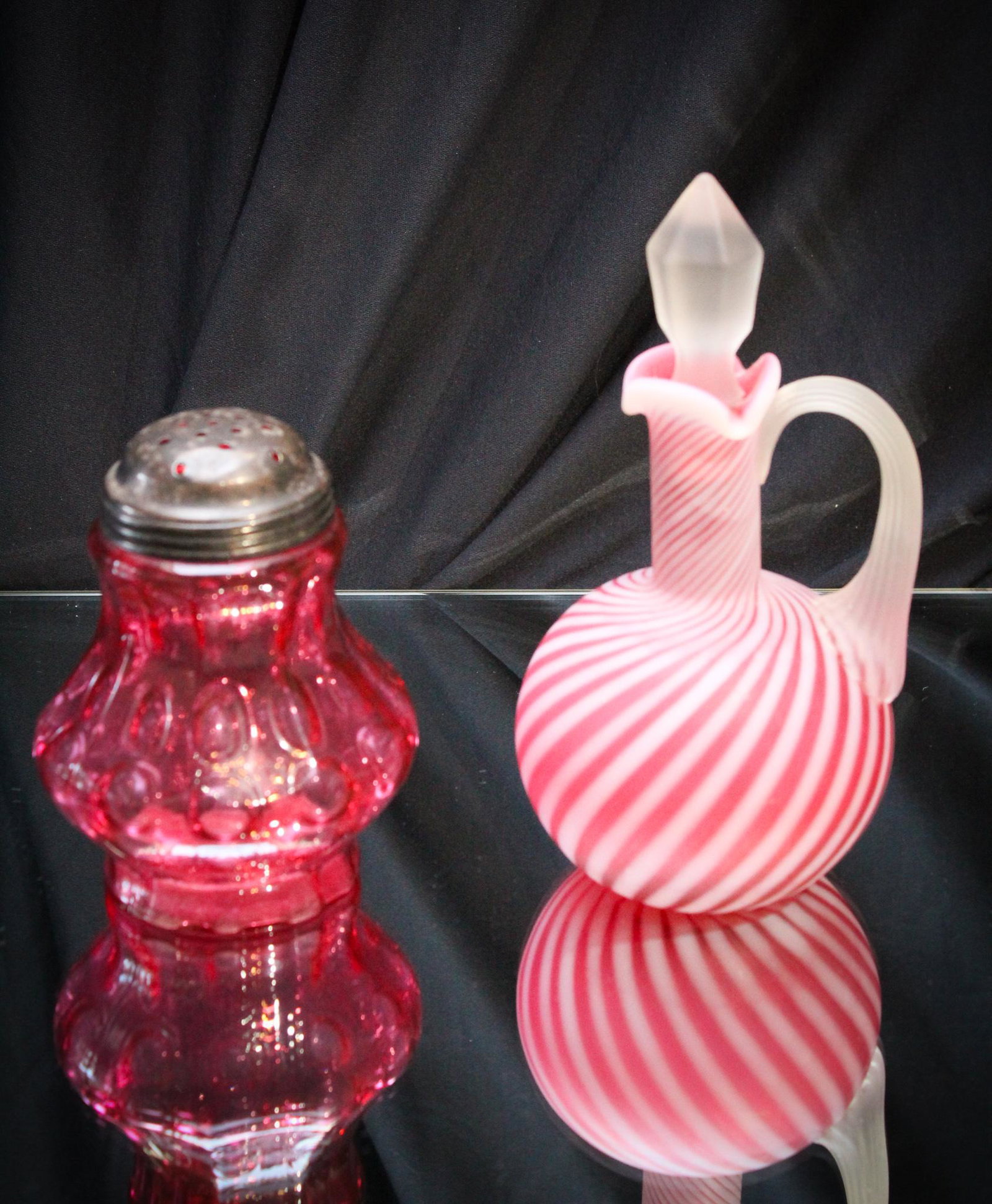 2 pc Lot Fenton L G Wright Glass Cranberry: Another nice pair offered. A cranberry opalescent satin swirl optic cruet and an iverted polka dot sugar shaker. Not to be confused with thumbprint! Totally different. Super pieces. Tallest measures 7