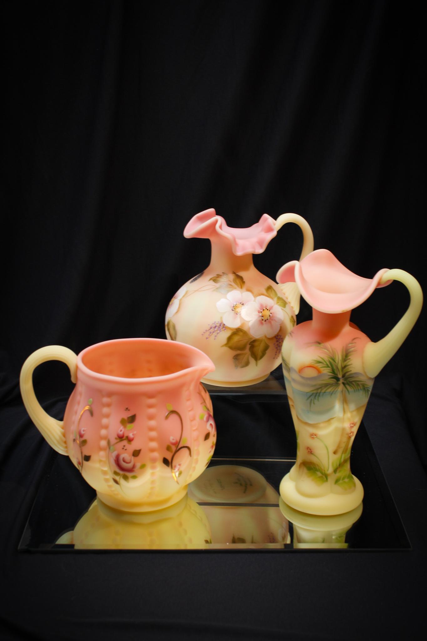 3 pc Lot Fenton Burmese Hand Painted Glass: Beautiful grouping of 3 pieces of Fenton Burmese all hand painted. So nice even your mean Mother in Law would like it! Tallest measures 9" tall.