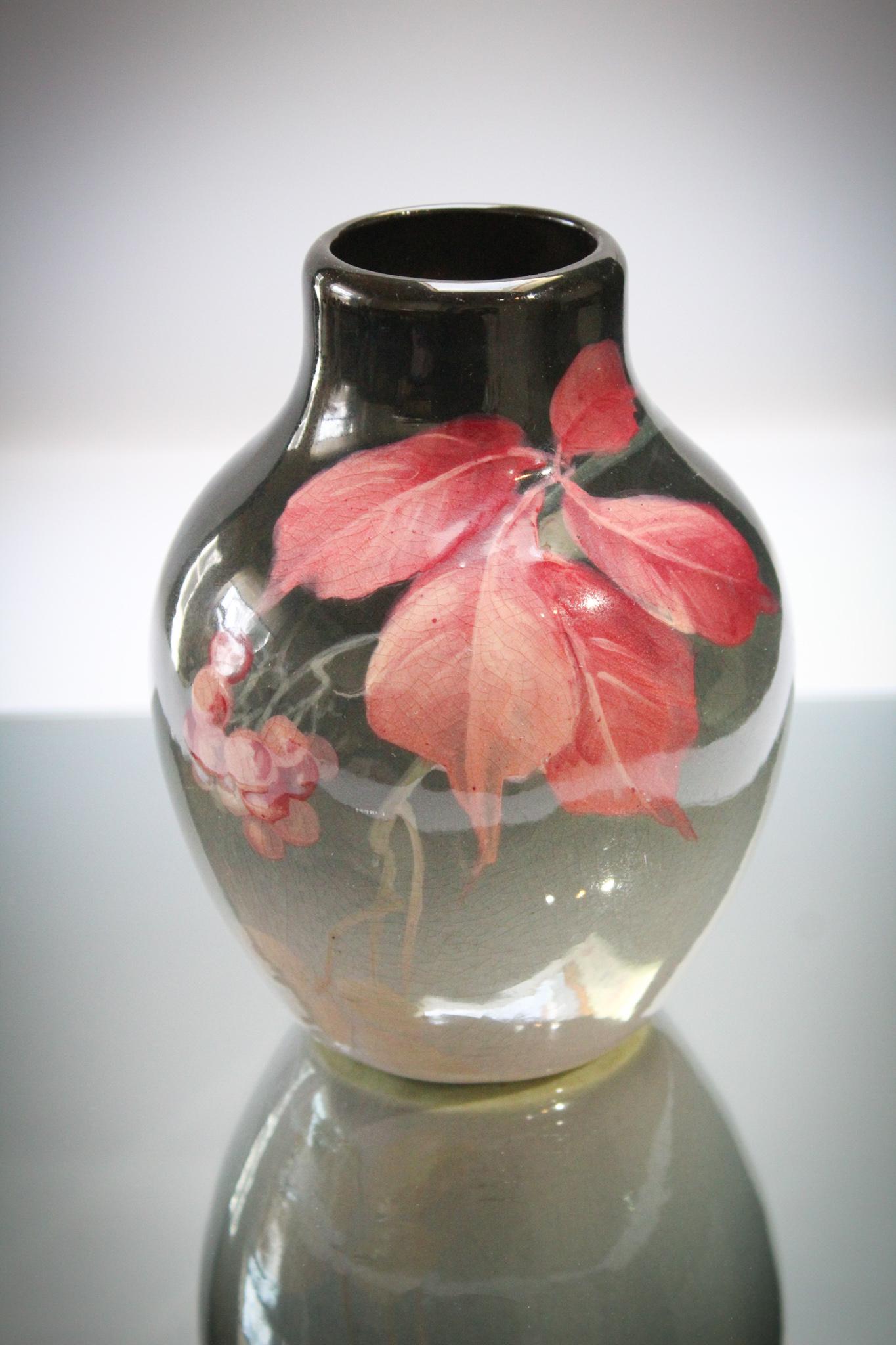 Weller Pottery Eocean Leaf & Berries Vase: A signed Weller Pottery Eocean line leaf and berries dÃ©cor vase. Vase measures 6 1/2' tall.