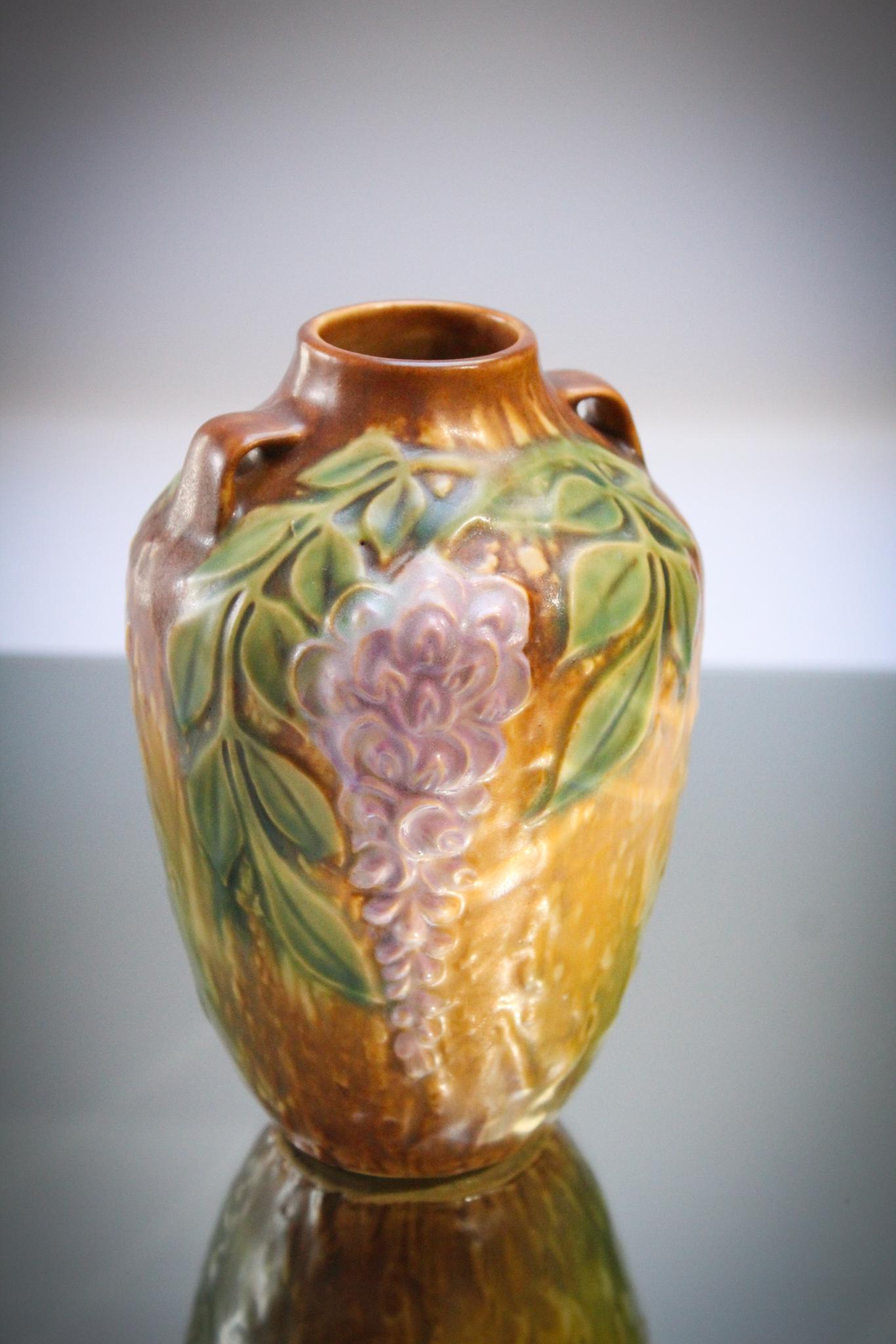 Roseville Pottery Wisteria Vase: Beautiful Roseville pottery signed Wisteria dÃ©cor vase. Measures 6" tall.