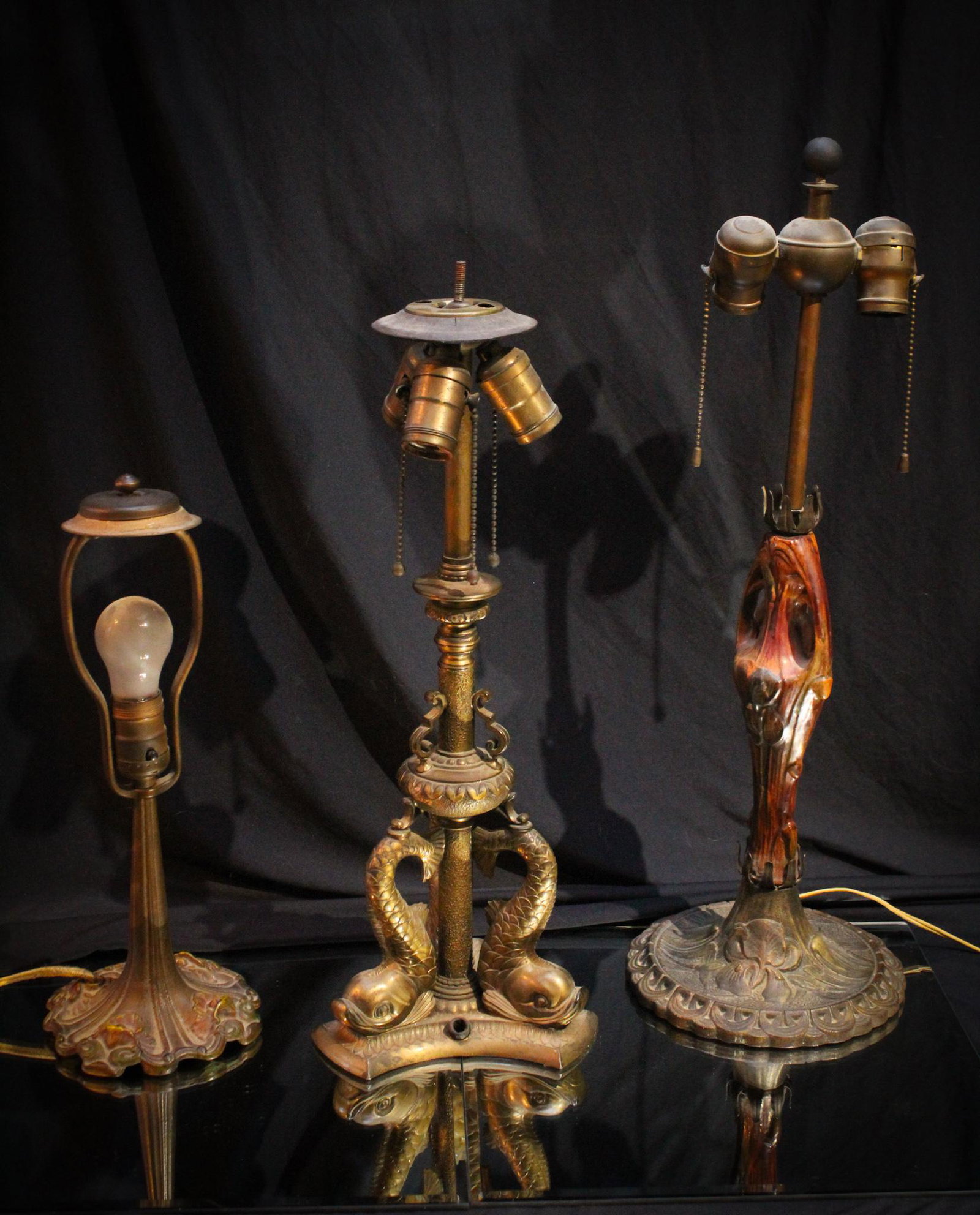 3 pc Lot Pairpoint & other Antique Lamp Bases: Lot of 3 antique lamp base including a figural pottery stem, a signed Pairpoint Dolphin base, and a cast boudoir lamp base. All as found. Tallest measures 22" tall.