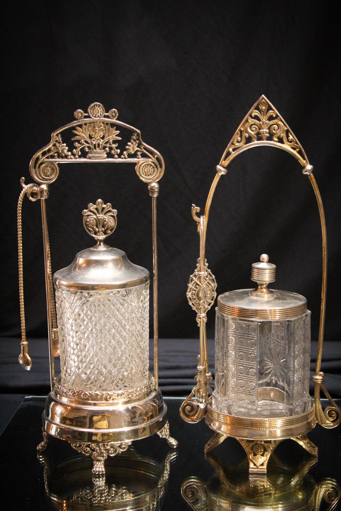 2 pc Lot Victorian Silverplate Pickle Castors: A great offering here. Two truly Victorian pickle castors. Nice condition with original inserts and complete with tongs. Tallest measures 12" tall.