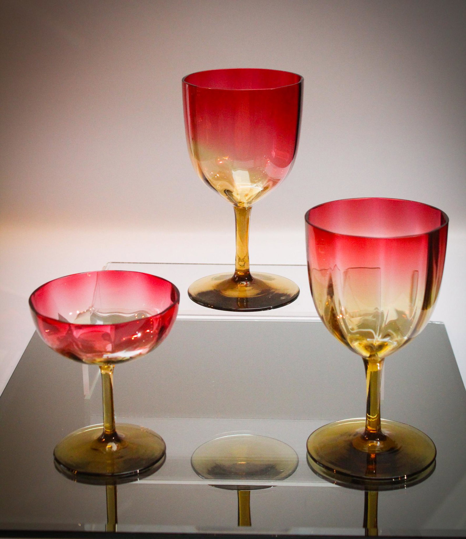 3 pc Lot Victorian Amberina Glass Stems: Let's drink to this lot ladies and gentlemen and undecided! A lot of two Victorian amberina water goblets and a pedestal sherbert. Seldom seen forms. Tallest measures 5 1/2" tall.