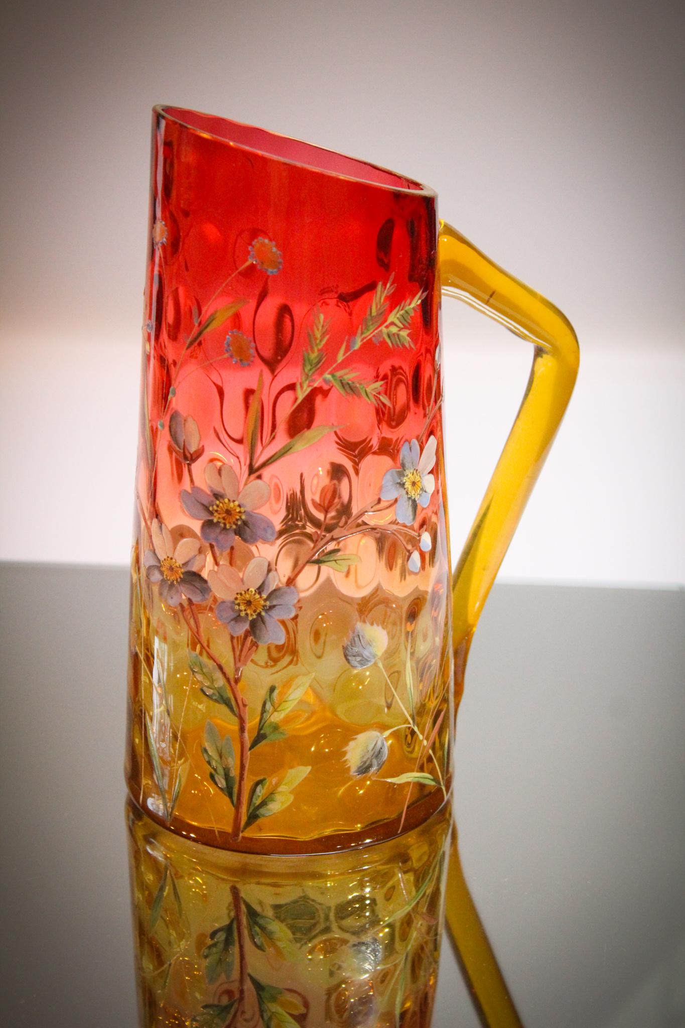 Amberina Victorian Enameled Glass Pitcher: Now this is nice. Here we go again offering some of the most wonderful items. Sale after sale we out do ourselves don't we? This piece is no exception. Graceful form on this amberina pitcher and what 