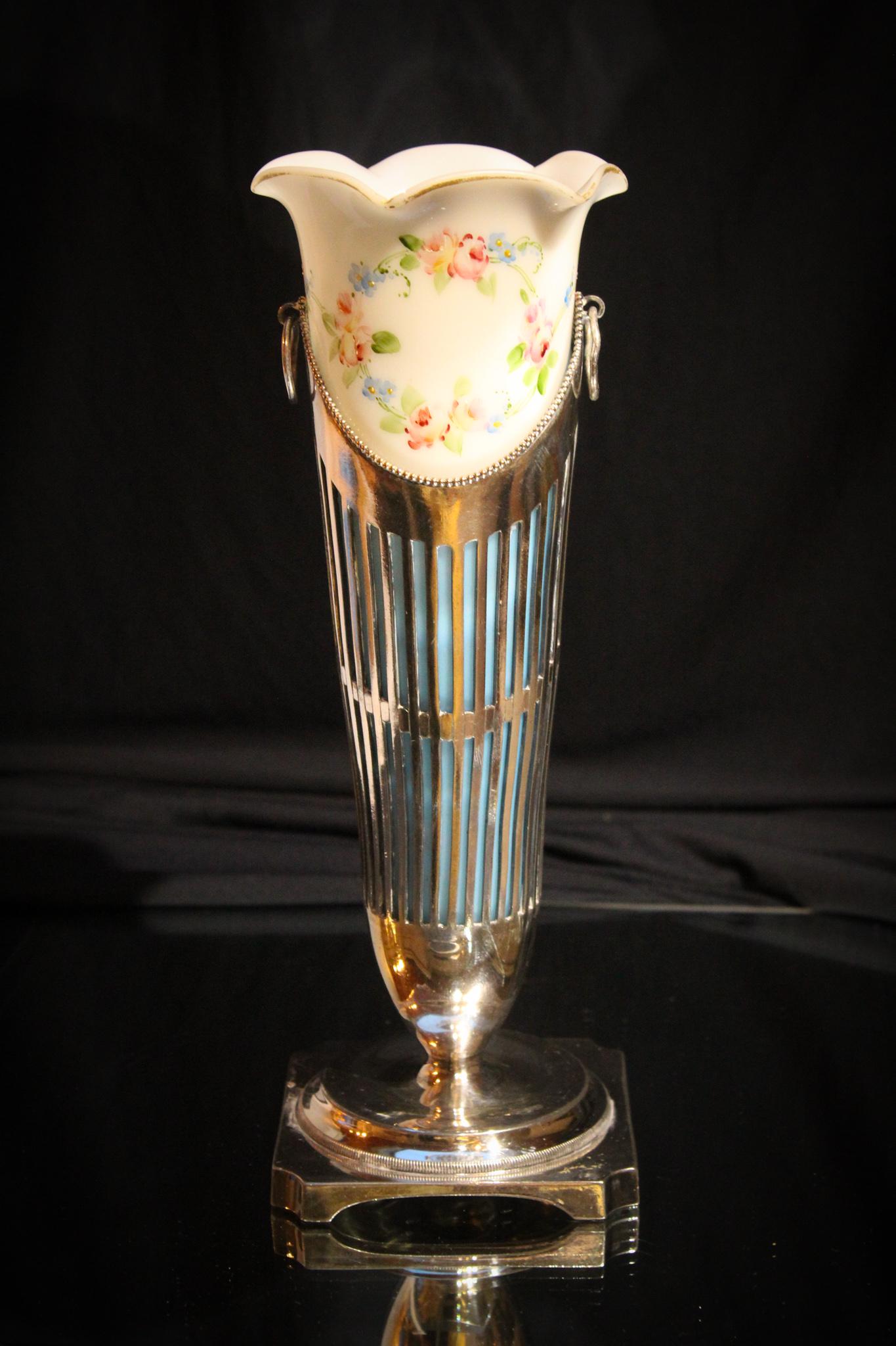 Pairpoint Silverplate Victorian Glass 11" Vase: Seldom seen signed pairpoint silverplate bud vase with original enameled glass insert. Insert has blue ground that is seen thru the silverplate openings. Delicate florals adorn this lovely. Signed as 