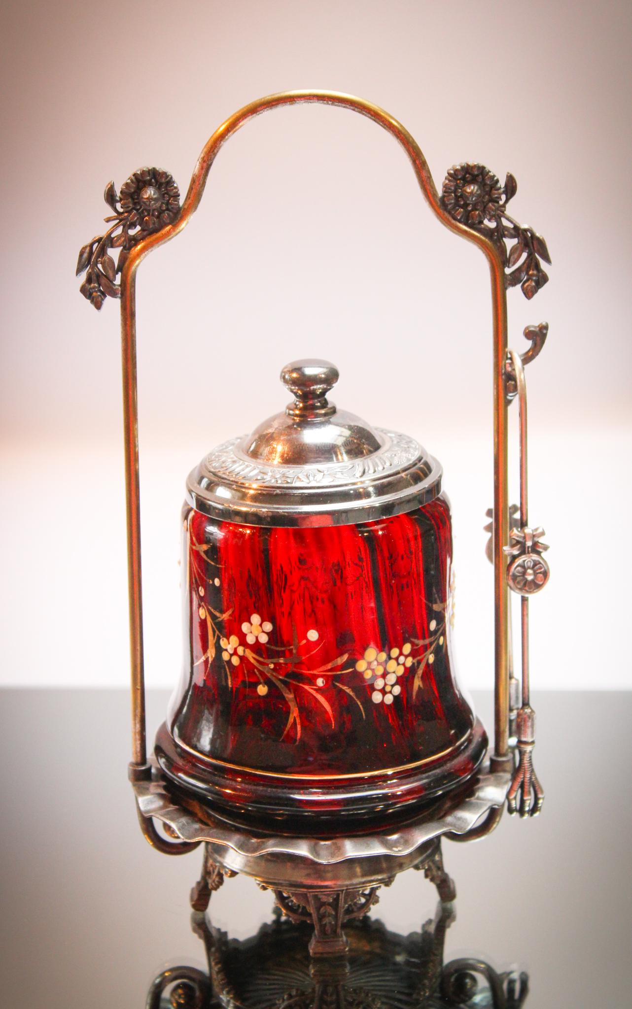 Rogers Silverplate Ruby Enameled Victorian Pickle: Ruby glass is so deep and rich. You can tell the Victorians loved it for its similarity to the actual precious stone. This castor has the deepest ruby coloring and delicate enameled flowers. Set in or