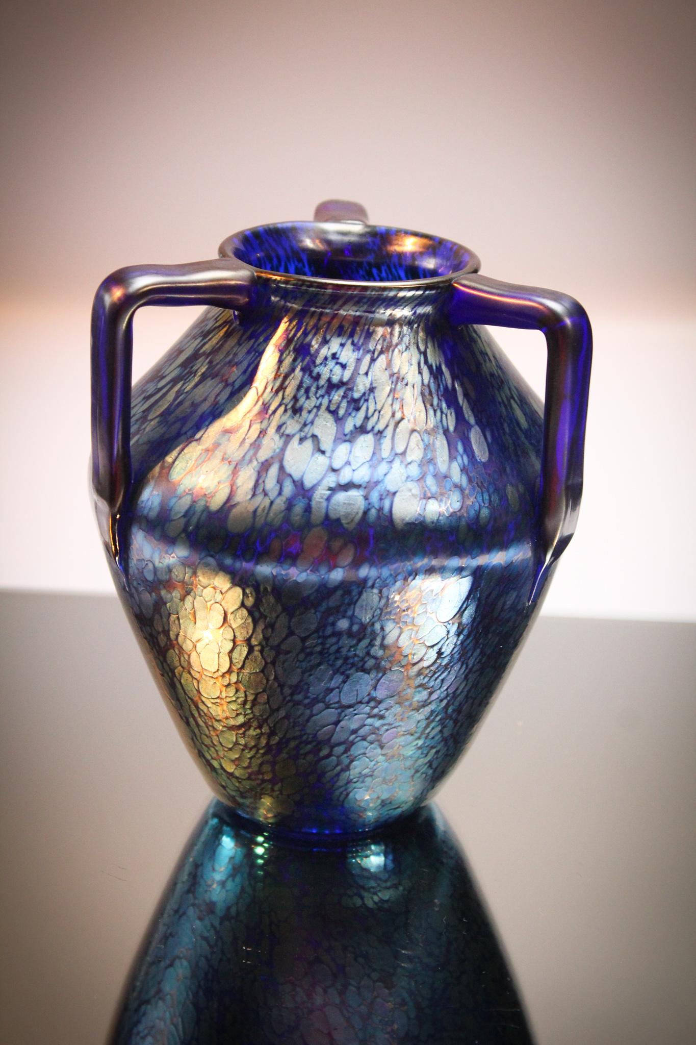 Loetz 3 Handle Papillon Deep Blue Vase: Exciting Loetz signed Czechoslovakia Papillon dÃ©cor Blue on black amythest vase. These piece is VERY showy with the best color you could want. Classic form. Measures 6 1/2" tall.