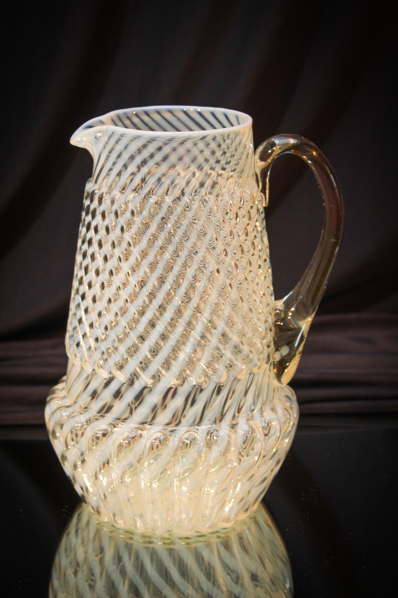 Scarce Northwood Chrysanthemum Base Opalescent Pitcher: You seldom ever find this pitcher in French opalescent. This a great Northwood pattern and also the pitcher doesn't come around. It's been a long while since we have seen the French opal. Measures 9 1