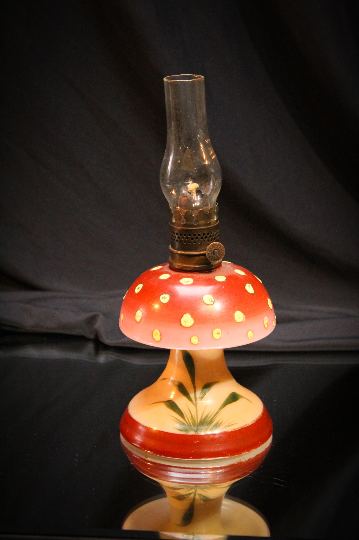 Toadstool Miniature Victorian Oil Lamp: OK. This is the cutest darn little miniature Victorian oil lamp. It's in the form a a red topped polka dot toadstool. Doesn't it just bring a smile to your face? We love it! Measures 4 1/2" tall to th