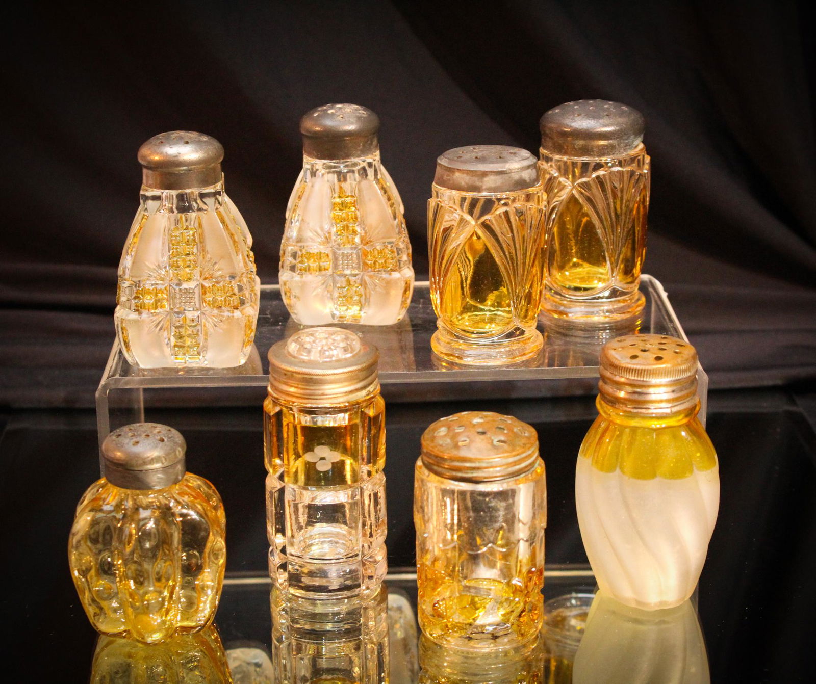 8 pc Lot Victorian Amber Stained Salt Shakers: What in the world? Yes. You guessed it. Some more great shakers from our consignor. Included in this lot are some choice examples of Millard, Findlay Klondike and more. Tallest measures 3 1/2" tall.
