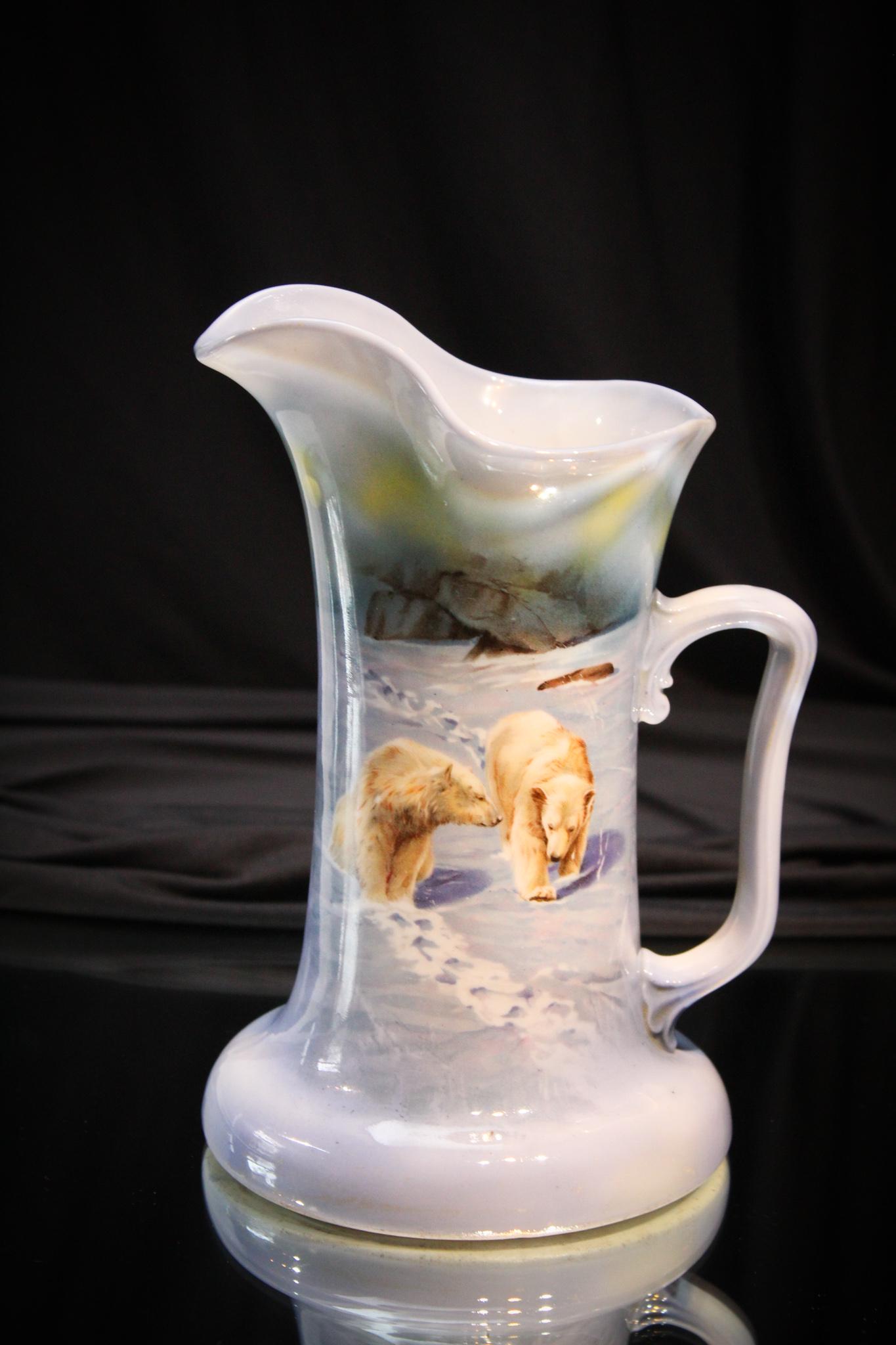 Royal Bayreuth Polar Bear Water Pitcher: Perfect time of year for the cuties. Seldom seen Polar Bear dÃ©cor on Royal bayreuth Tankard pitcher. Pitcher is lovely with great icey blue color and nice form. Pitcher measures 8 3/4" tall.