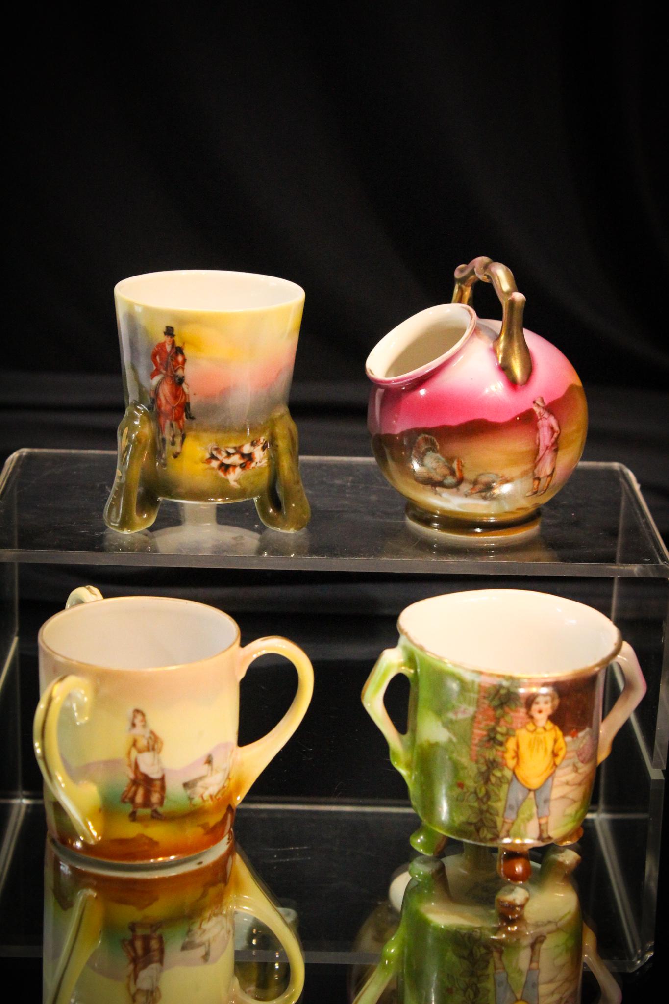 4 pc Lot Royal Bayreuth Toothpick Holders: These are so collectable and we love these designs. A hunt scene, a turkey, a duck and a little boy. Tallest measures 3 1/2" tall.