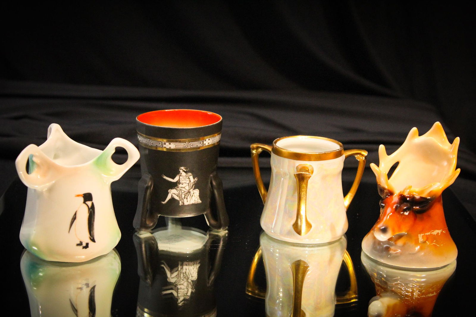 4 pc Lot Royal Bayreuth Toothpick Holders: Folks,here are some nice toothpicks. A figural elk, a penguin design, a Grecian design, and an Irridized example. Tallest measures 2 7/8" tall.