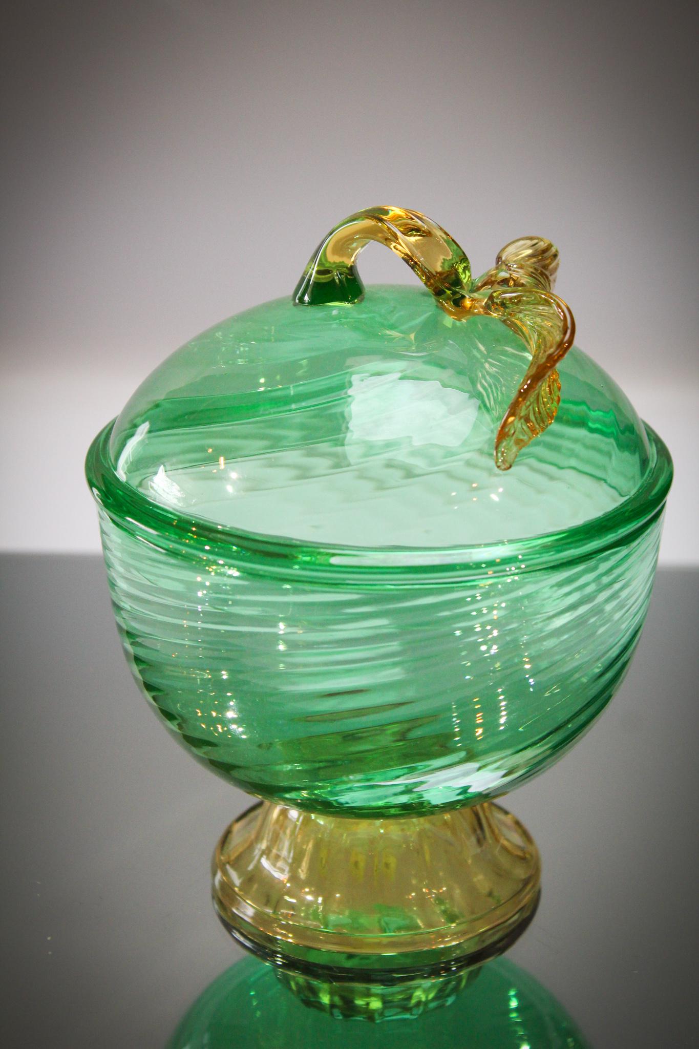 Steuben Green Amber Covered Jar Box: Applied leaves add to the beauty of this lovely. Wonderful coloring and detail. Measures 7" tall.