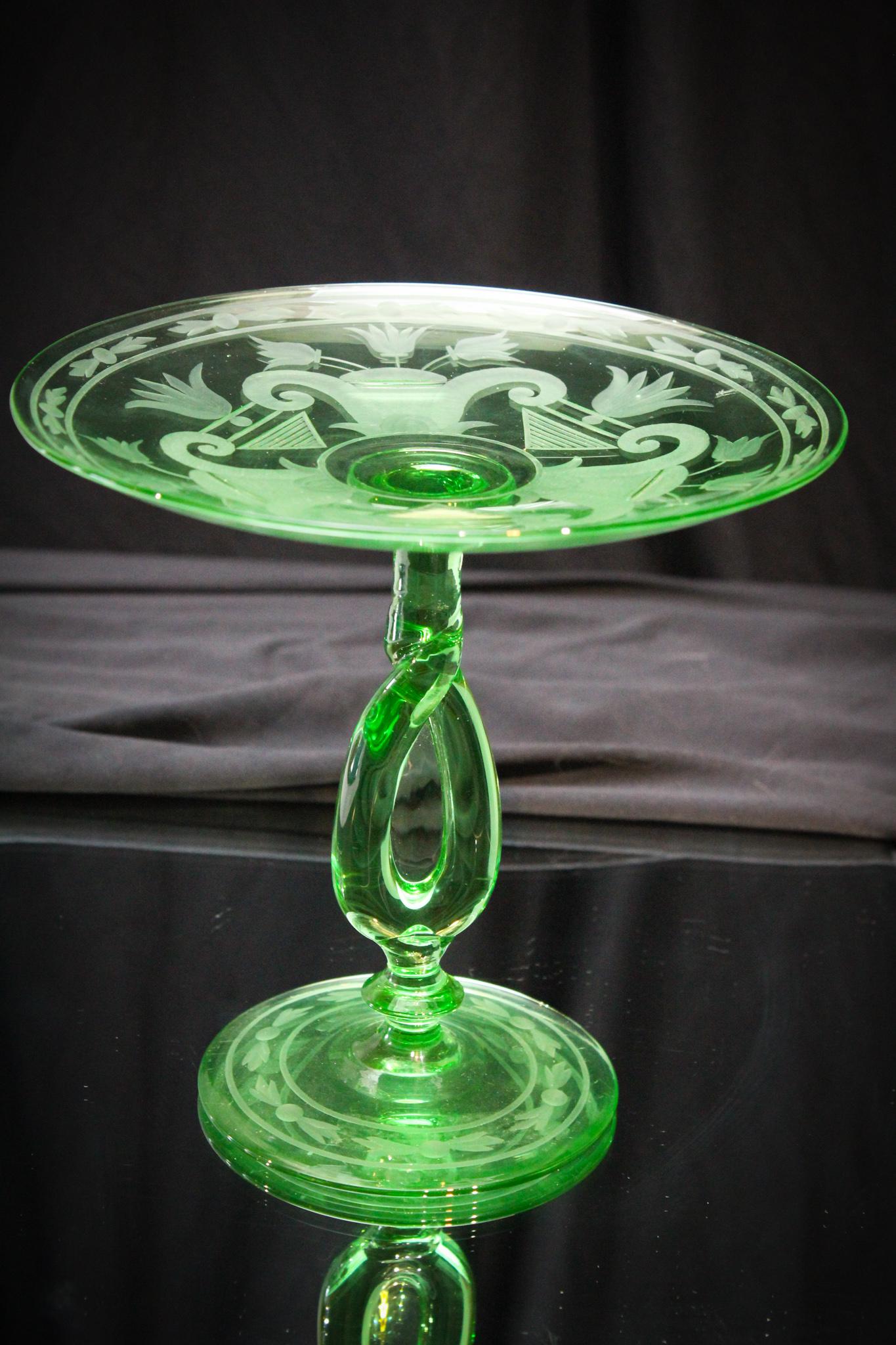 Pairpoint Osiris Engraved Green Pedestal Compote: Pairpoint green twisted stem Osiris pattern engraved pedestal compote. Great color and clarity to the glass. Measures 7 1/4" tall.