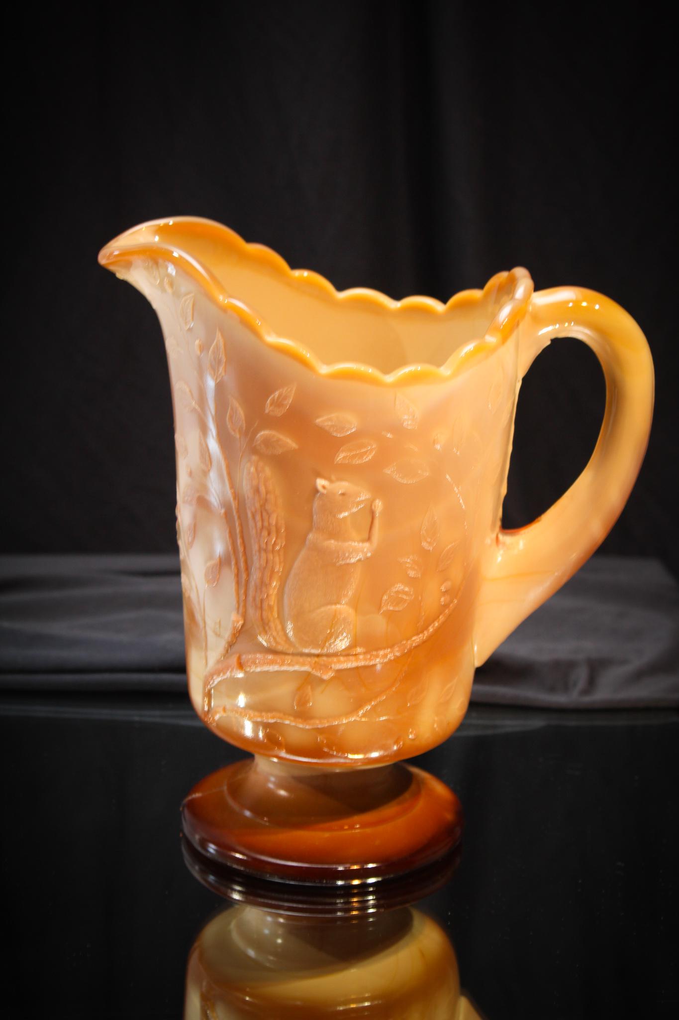 Greentown Chocolate Glass Squirrel Water Pitcher: Super nice example of a Chocolate squirrel pattern water pitcher. Measures 8 1/2" tall.