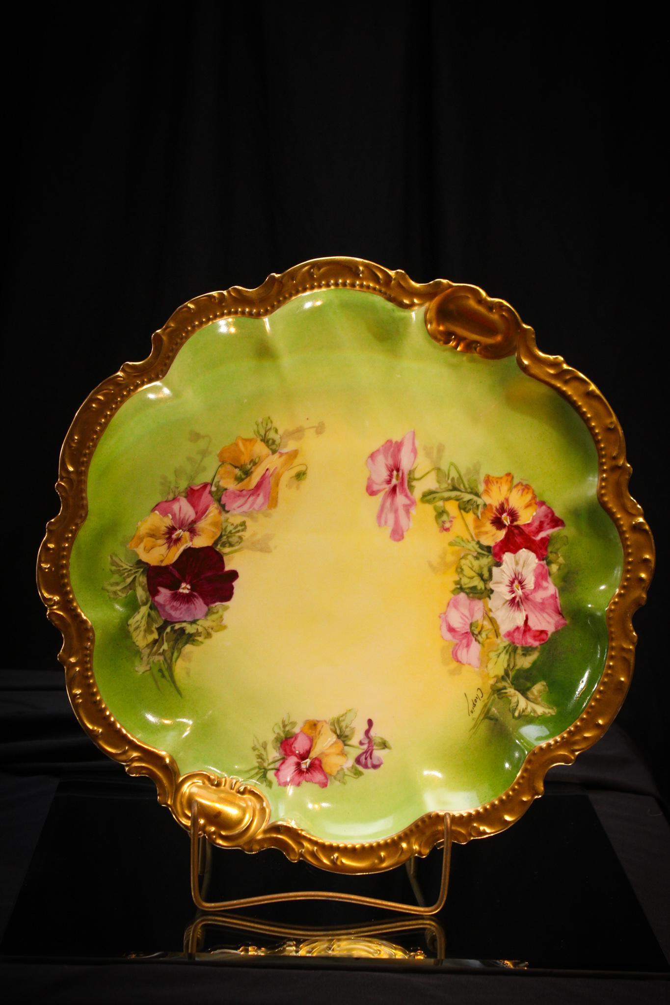 Limoges France 12" Signed Porcelain Pansy Charger: Pansy dÃ©cor artist signed Limoges Porcelain 12 1/2" charger. We love pansies. Such delightful little faces looking at you. These are nice and colorful. Lovely piece.