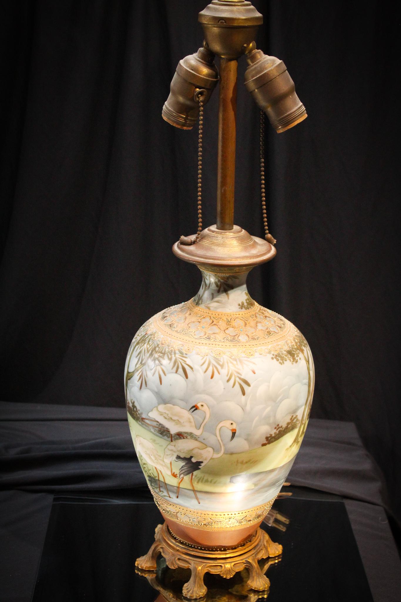 Nippon Jeweled Flamingo Porcelain Vase lamp: Folks, this lamp is beyond beautiful. Expertly jeweled and decorate Nippon Vase lamp has original mountings and hardware. Impressive piece with incredible detail. Measures 28" tall.