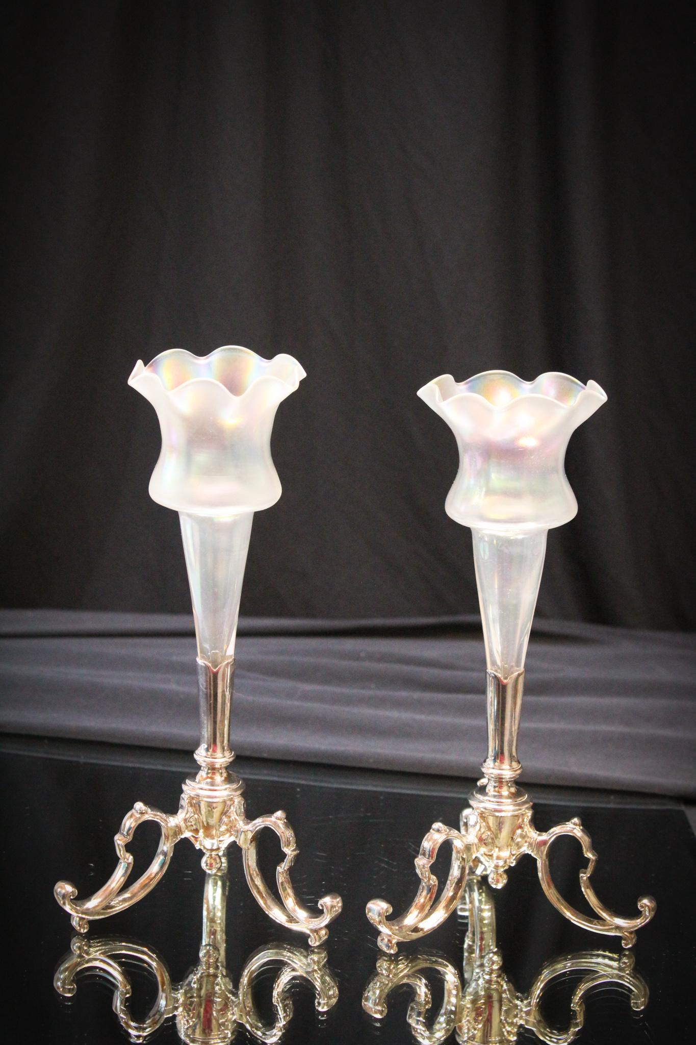 Pair of Victorian Art Glass Trumpet Vases Silverplate: We love irridescent glass and this pair is no exception. A matched pair of irridescent trumpet vases in numbered silverplate holders. Each measures 8 1/2" tall.