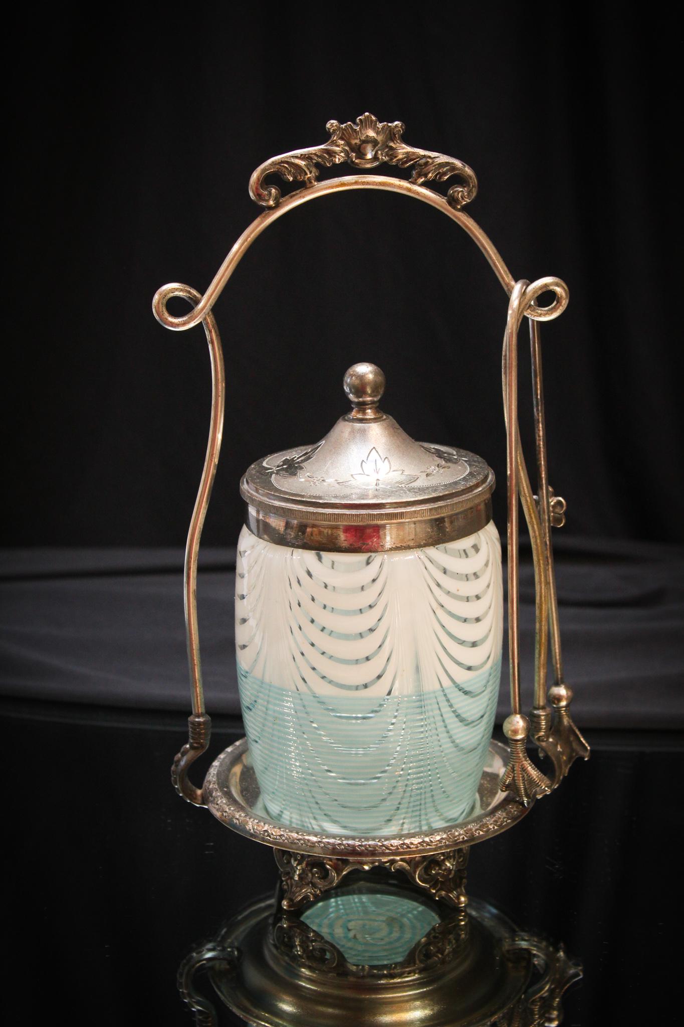 Rare Hobb's Venetian Blue Pickle Castor: What a tough one this is. A Hobb's Blue threaded Venetian pattern pickle castor in Pairpoint signed silverplate holder. Measures 10" tall.