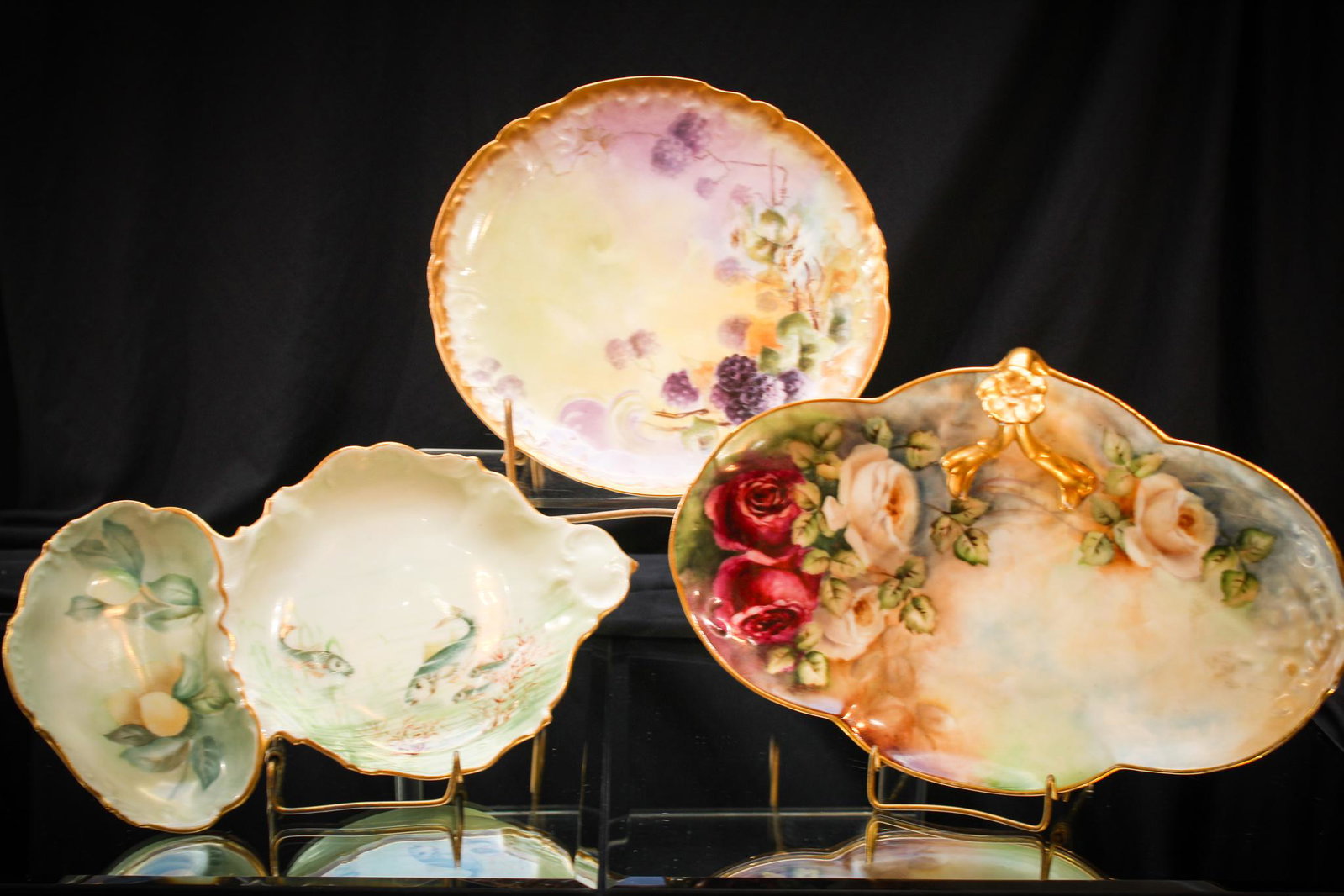 3 pc Lot Limoges More Porcelain Rose & Fish Decor: A 3 piece lot of all signed pieces of Porcelain to include a rose dÃ©cor tray, a signed Limoges fish dÃ©cor tray, and a blackberry dÃ©cor plate. All very well executed. Largest measures 11".