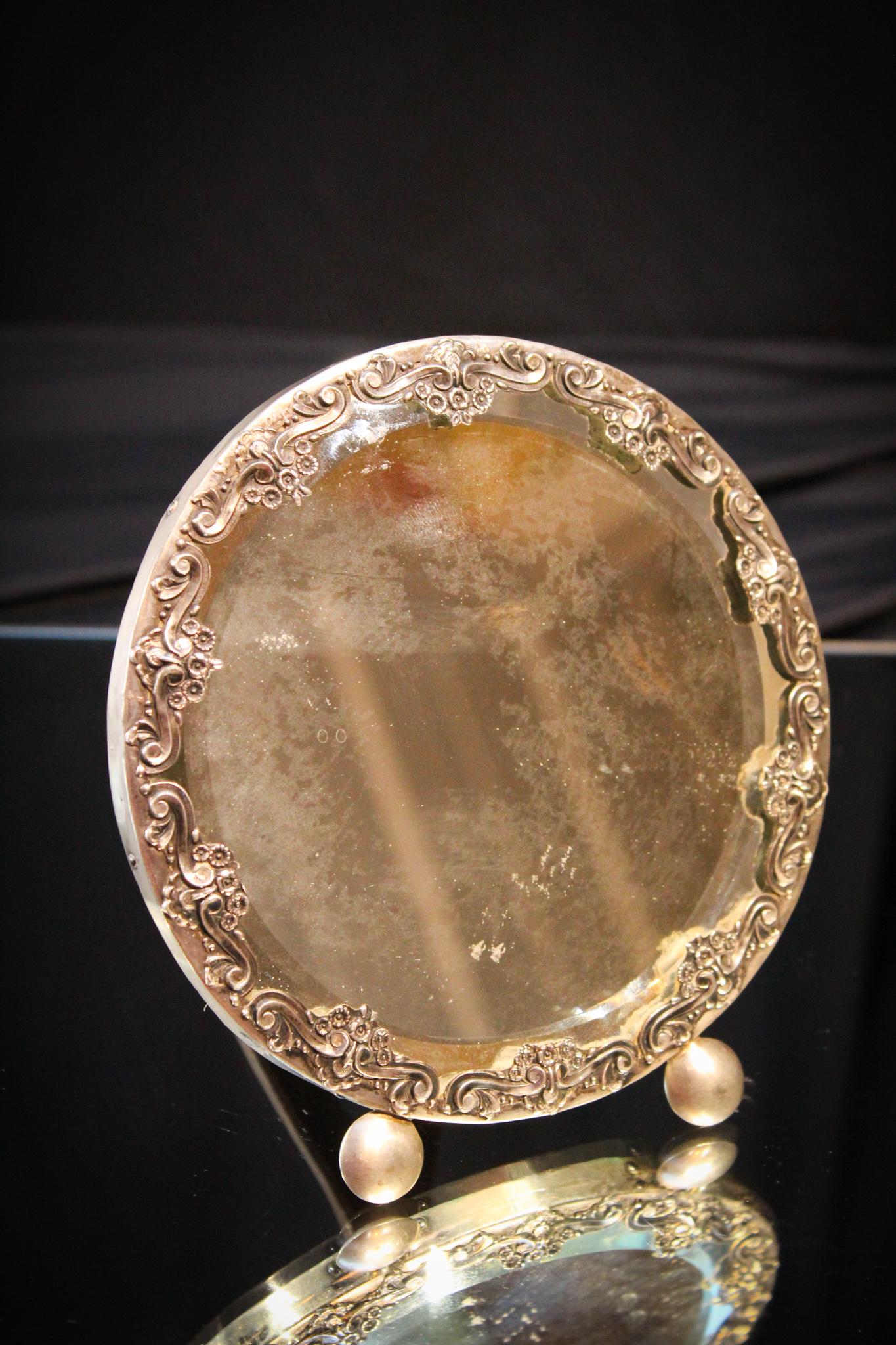 Antique Embossed Silverplate Vanity Mirror w/ Wood: Lovely antique silverplate embossed floral dressing vanity mirror with wood backing and easle. Would nake a perfect gift. Measures about 5" tall.