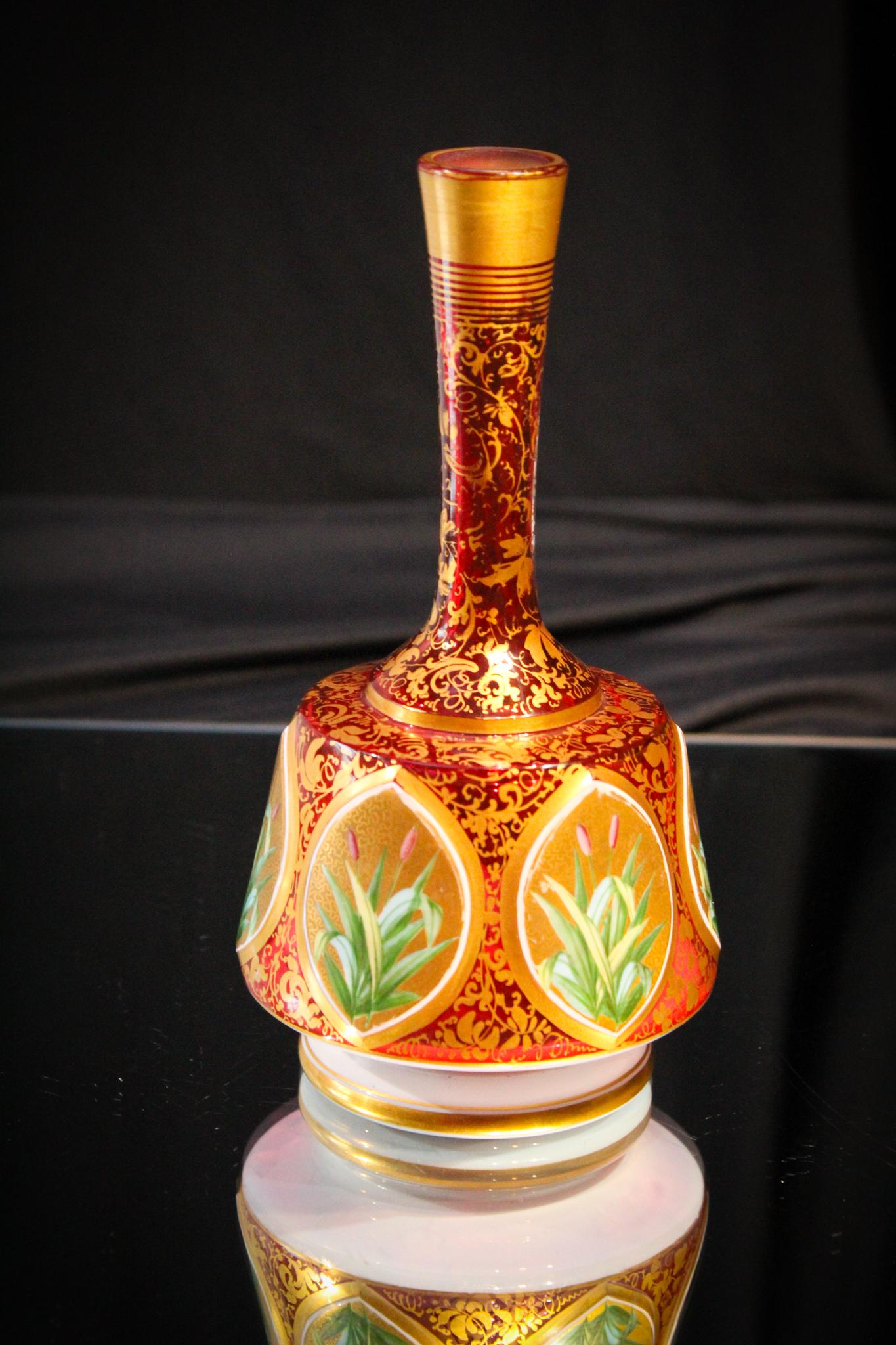 Moser Cranberry Cut Glass Cabachon Cattail Vase: What an unusual dÃ©cor for this type of Moser cranberry glass. Not portraits on the panels, but cattails. Piece is elaborately gilt decorate with amazing no wear. Deepest of cranberry glass. Museum 