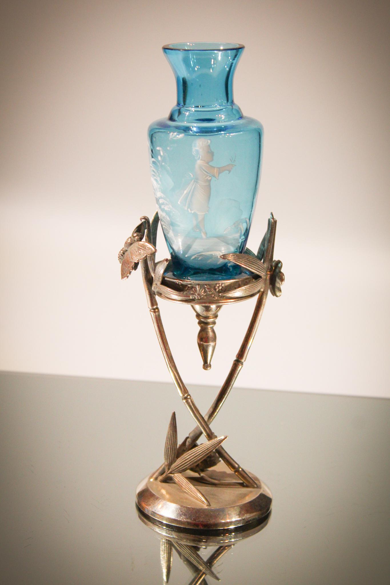 Blue Mary Gregory Glass Vase Tufts Silverplate: This is a little cutie. Original to Tufts silverplate holder, this blue mary Gregory vase is sweet. Diminutive in size. Measures 8 3/4" tall.