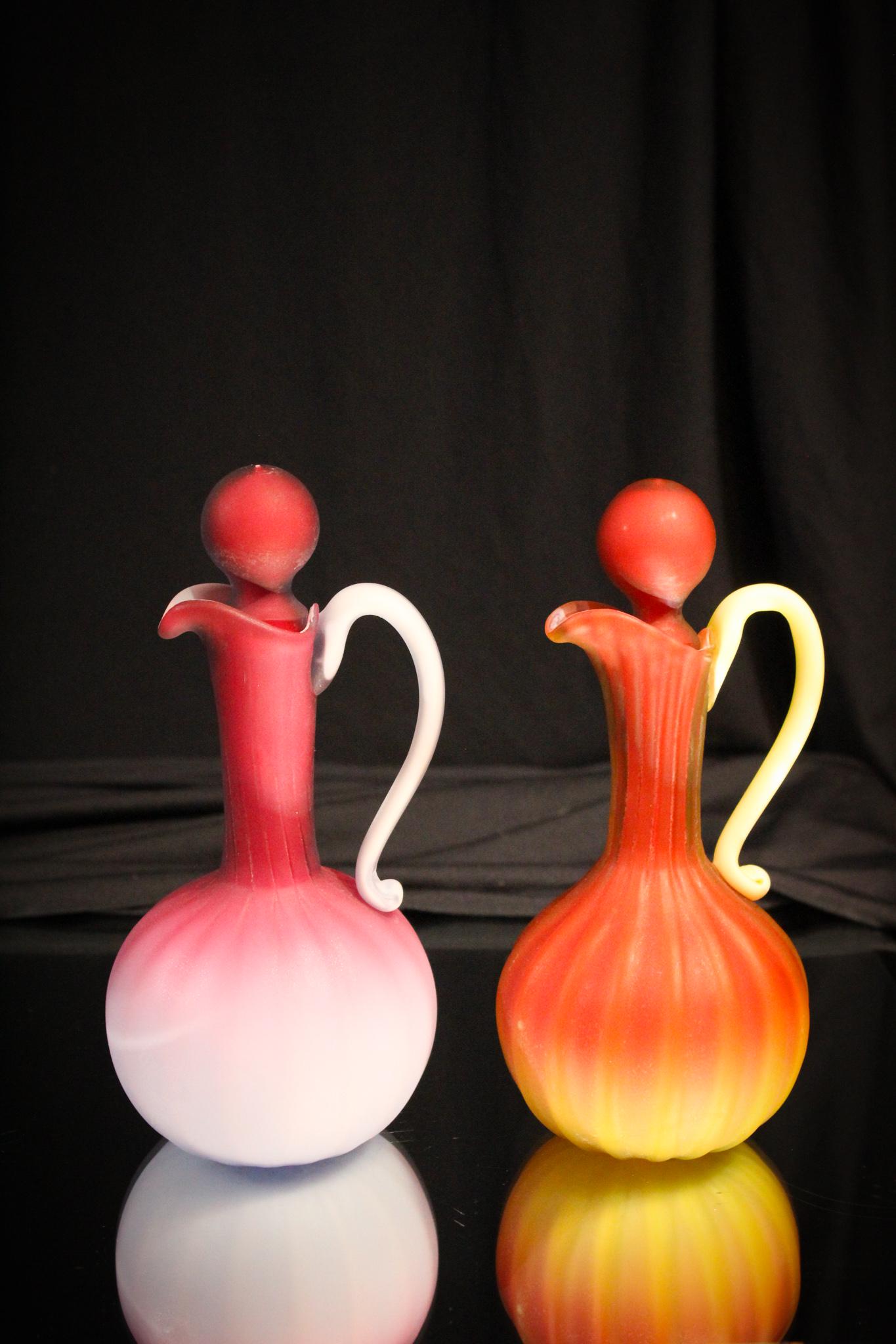 2 pc Lot Antique Murano Art Glass Cruets: These are defintely a choice pick for your collection. One made in peachblow color of deep pink shading to blue. The other being a burmese color ribbed body and cased in vaseline. Both retain original
