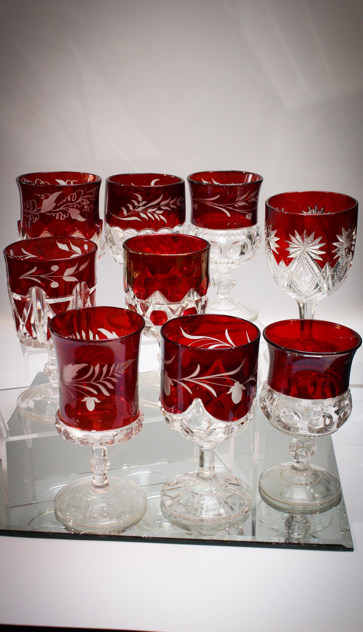 9 pc Victorian EAPG Ruby Stain Goblets: Set the table for the dinner party tonight folks with this grouping of beautiful Victorian Ruby stained stems. All unique in pattern and dÃ©cor.
