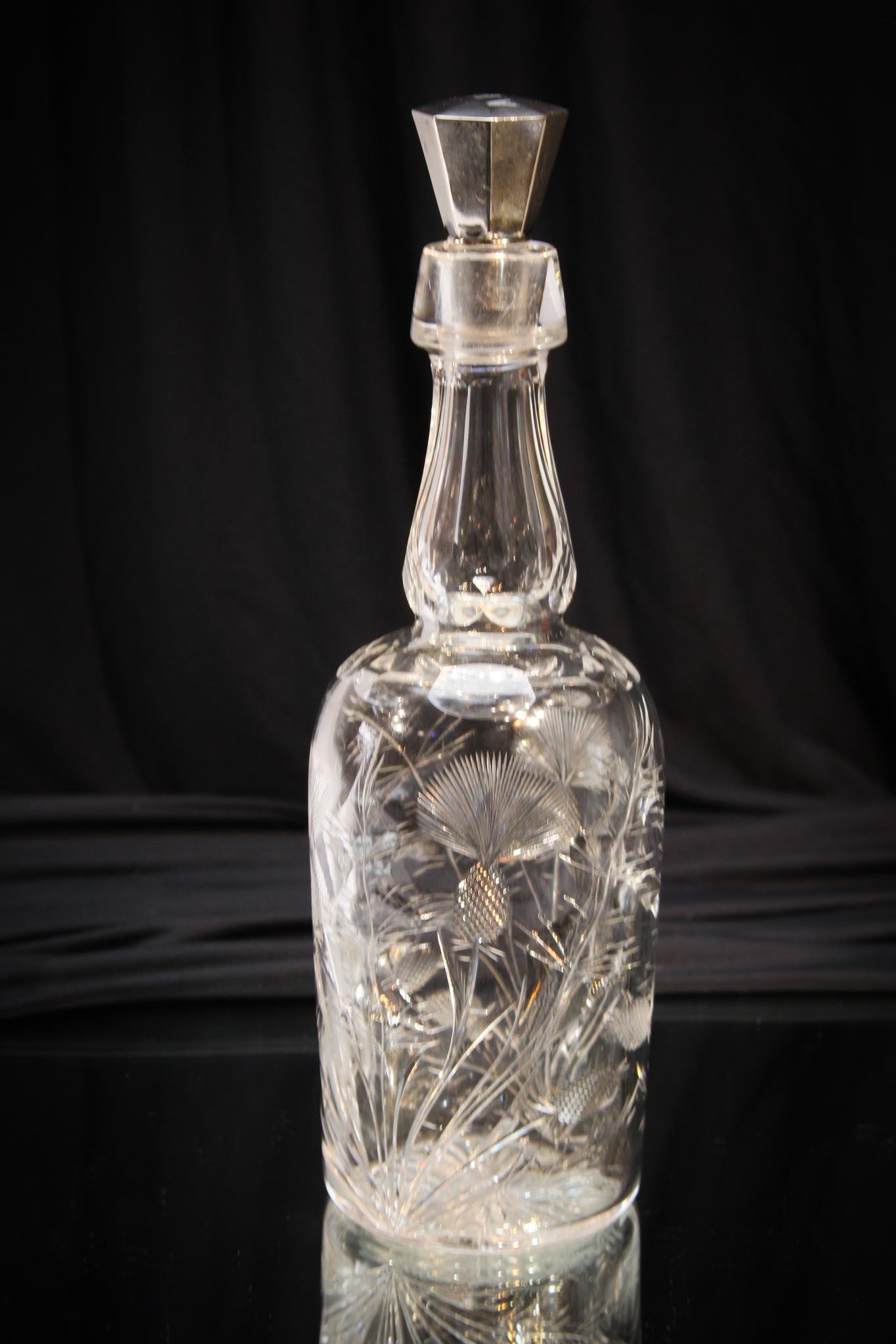 Pairpoint Glass cut Thistle Sterling Stopper Decanter: Well done Pairpoint cut glass thistle pattern decanter with sterling stopper. Nice impressive piece with great cut detail. Measures 12" tall.