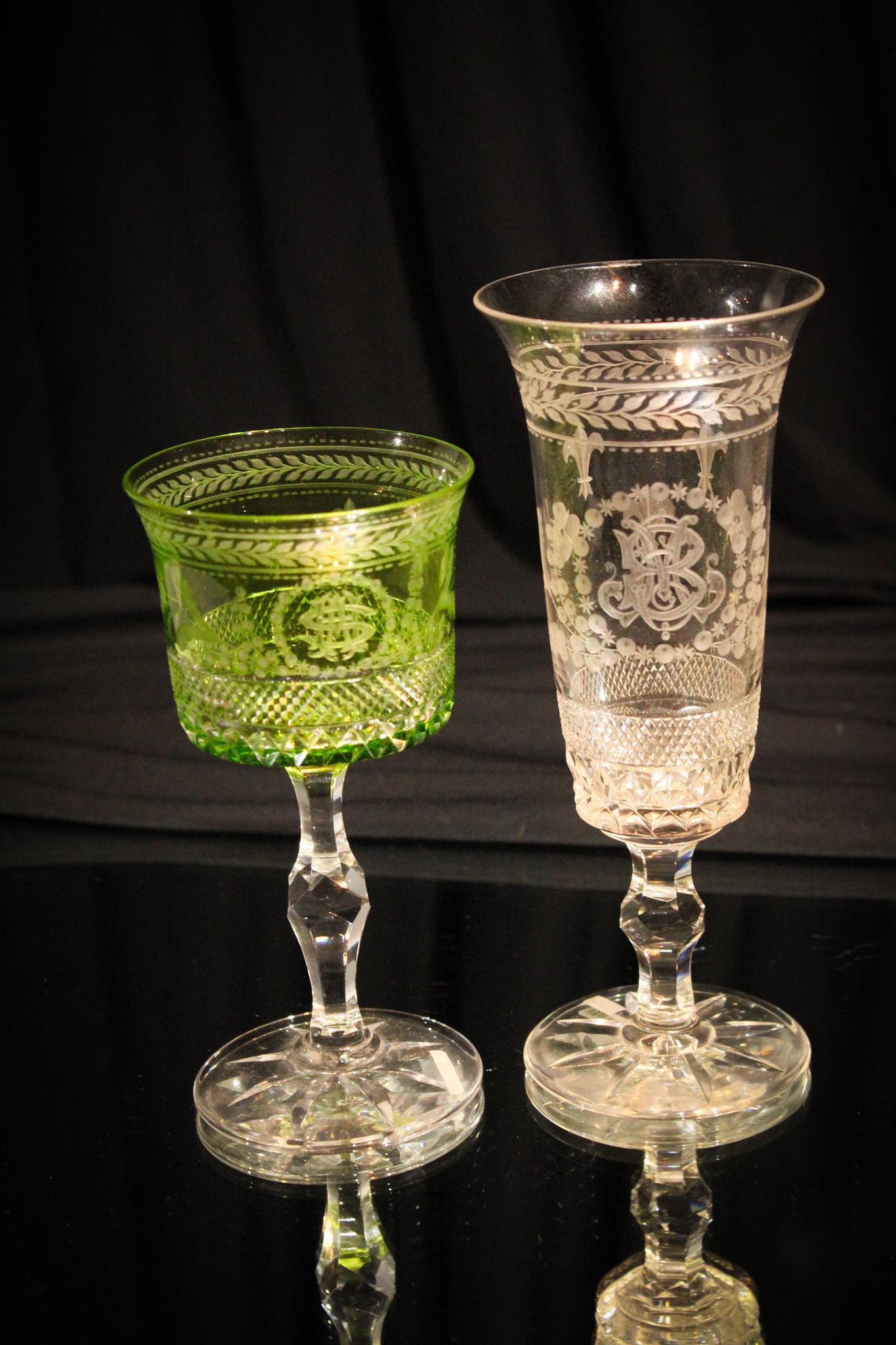 2 Baccarat Hawkes Cut Mongram Stems Louis XVI: Offered is two stems. Baccarat Blanks, cut by Hawkes in the Louis the XVI pattern. One green to clear. Both unique monograms. Green measures 5 3/4" tall. Clear measures 6 7/8" tall.