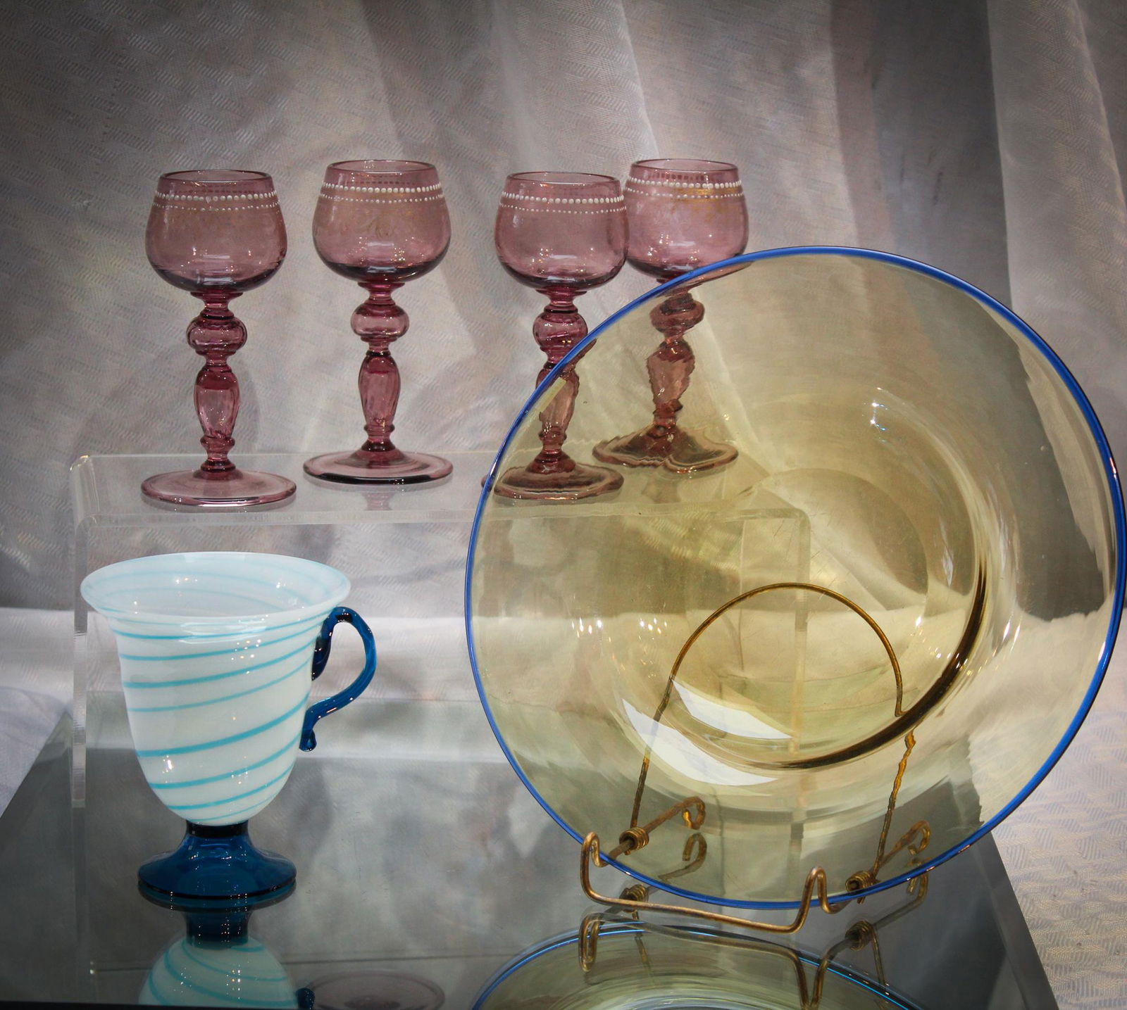 6 pc Lot of Steuben, Frye, Bohemian Glass Goody Lot: Magnum Auctions Goody Lot of 6 pieces comprised of a Steuben plate, a pseudo Frye glass cup, and 4 Bohemain amythest cordials.