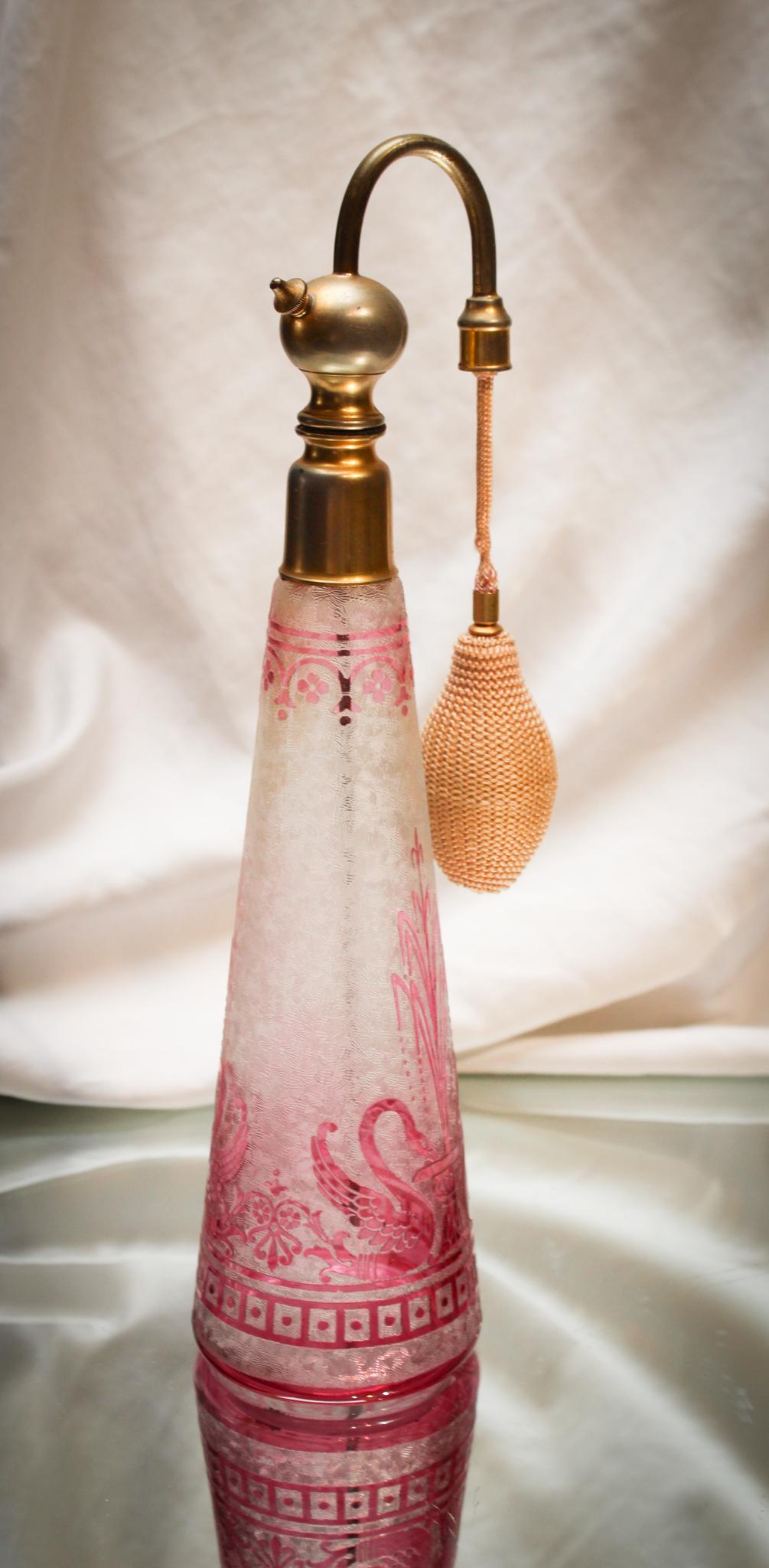 Baccarat Cameo Swan Perfume Atomizer: What a honey this is. Gorgeous tall signed baccarat Atomizer with swan motif. Original mounts on this killer piece. The detail is amazing. Check it out! Measures 12" tall.