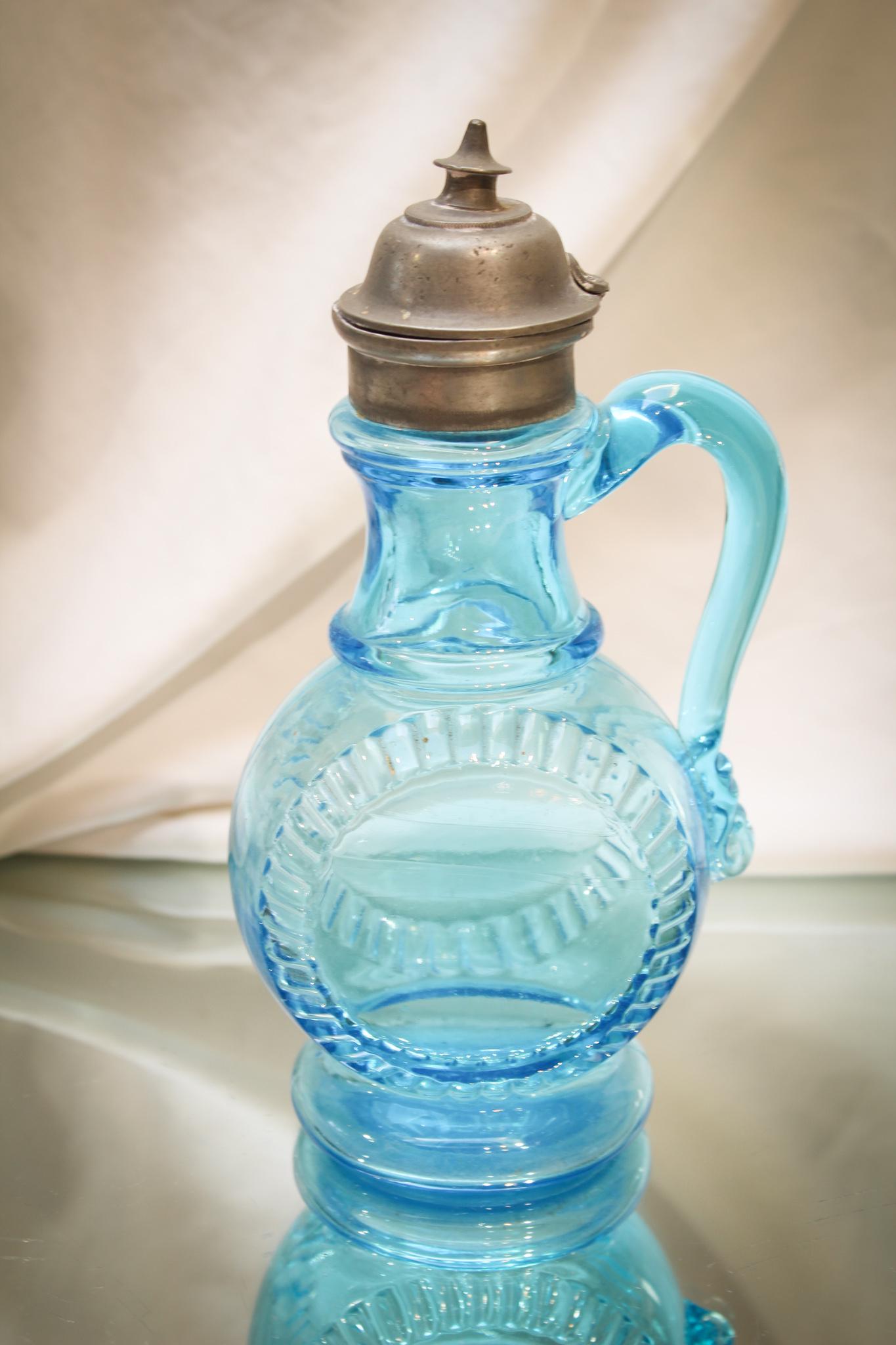 Central Glass Pilgrim Victorian Syrup Pitcher: We love the color blue in this syrup. Brilliant and yet, such an odd a shape that we guess works. Made by Central Glass, this piece retains the orginal lid.