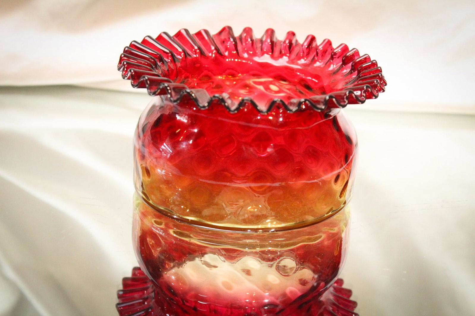 Amberina Victorian Mt. Washington Open Sugar: Look at the rich coloring of this piece of Mt. Washington glass. The extraordinary clarity and diamond quilt optic pattern to the glass. Look at the firm tightness of the crimping of the glass. Almost