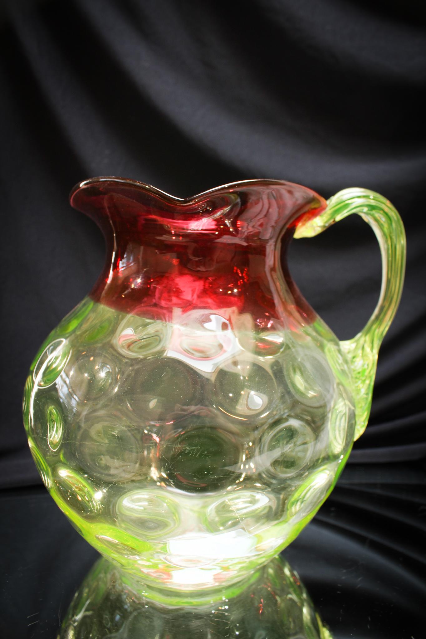 Hobb's Rubina Verde Victorian Glass Pitcher: This coloring is always a favorite among collectors. Hobb's got it right when they did this one. Rich cranberry coloring with crisp lemon yellow vaseline. Nice piece folks! Measures 8" tall.