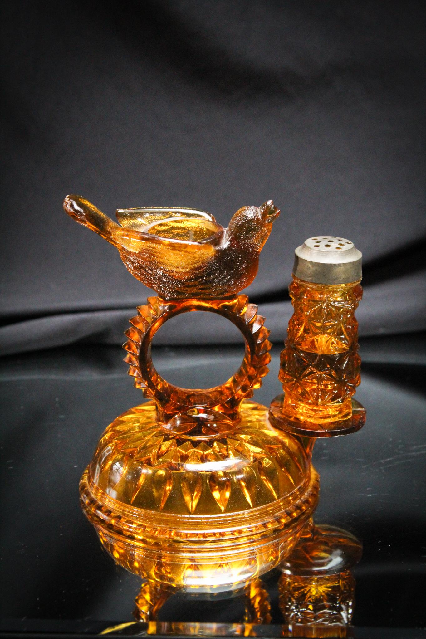 Victorian Bird w/ Berry Novelty Napkin and Shaker castor: Such a sweetie. This little bird brings your salt and napkin to you at the table. So typically Victorian. Measures 5" tall.