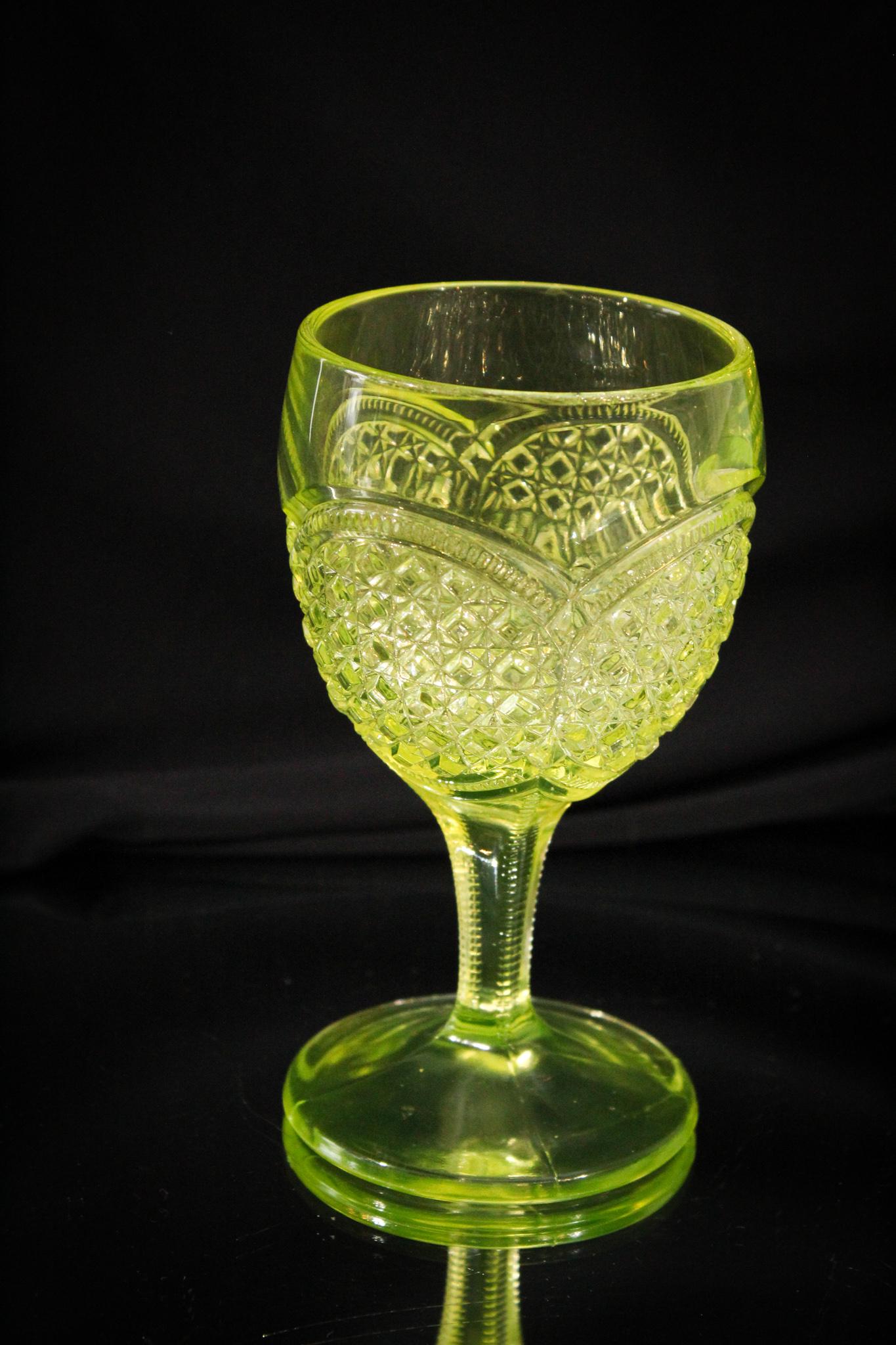 Greentown Vaseline Austrian Victorian Water Goblet: Anyone thirsty? Especially for some fantastic Greentown glass. Well hopefully your thirst will be quenched for a while after our Anniversary auction. We do have some fabulous items. Thiis is a Greento