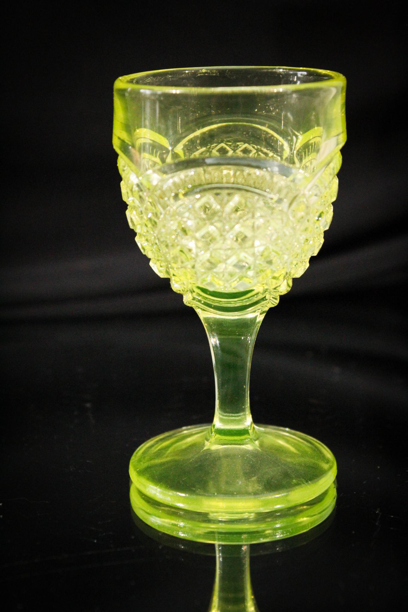 Greentown Vaseline Austrian Victorian Wine Stem: Time to crack open a bottle if you win this guy. Maybe have two. It is time to celebrate if you win some goodies at Magnum Auctions! This Greentown Austrian wine stem in vaseline glows brilliantly und