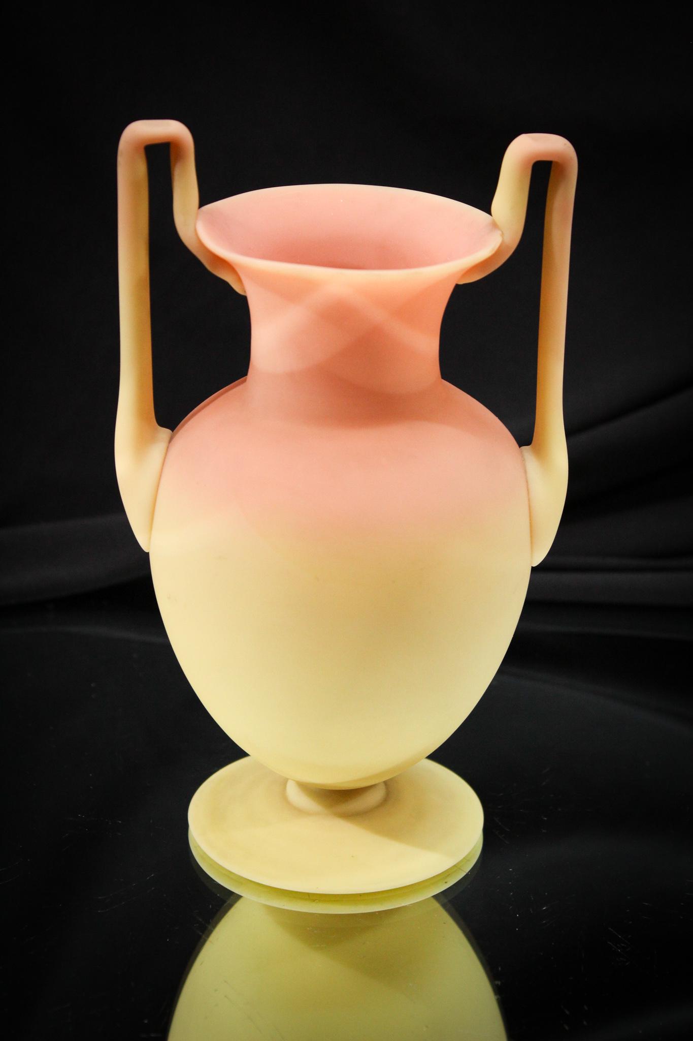 Mt. Washington Burmese Egyptian handle Victorian Glass Vase: Such a nice form is this Mt. Washington burmese Victorian glass Egyptian handle vase. Very impressive with great attention to detail. Look at the pedestal base. Look at the angular handles and satin f