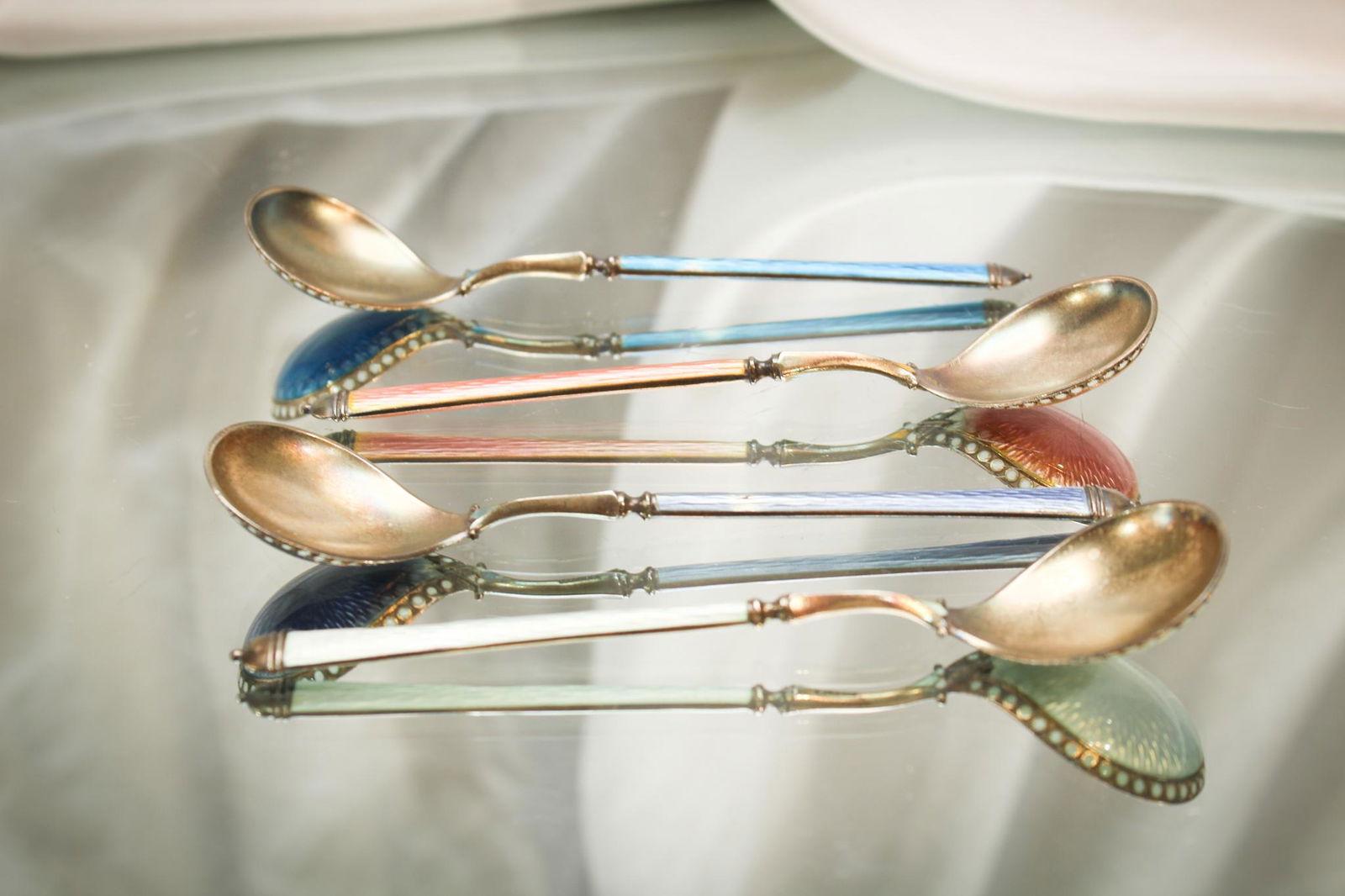 4 pc Lot Norwegian David Anderson Sterling Enameled Spoons: Great offering of 4 Norwegian David Anderson sterling enameled spoons. Each measures 5 1/4" long.