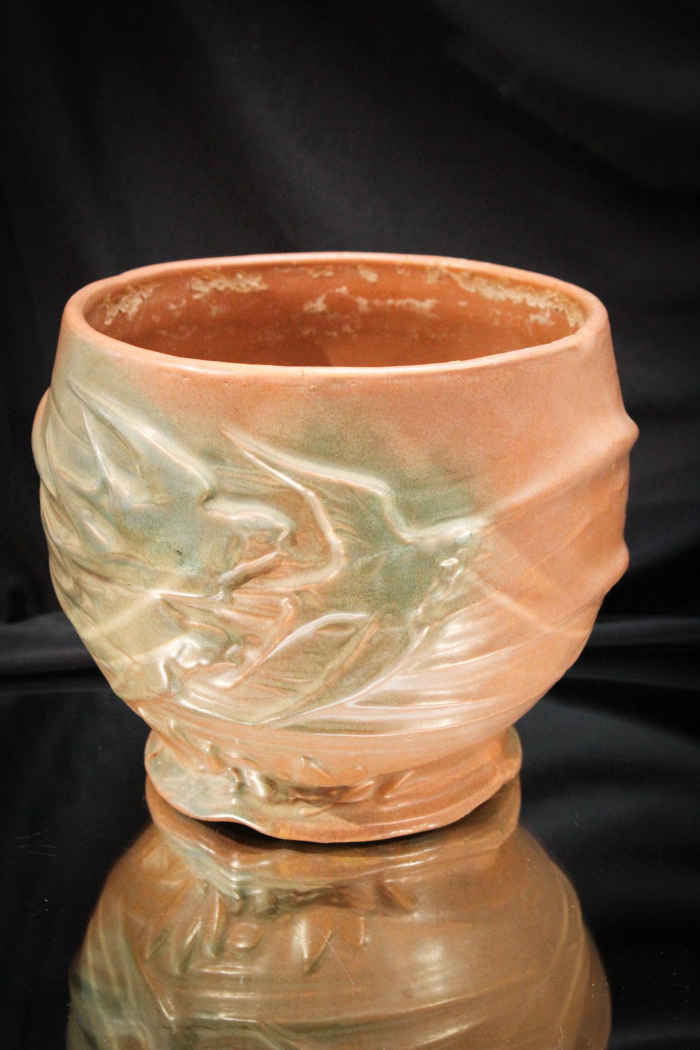 McCoy Pottery Jardinere with Birds: Great useful piece of McCoy pottery. Here's a jardinere just in time for the summer. Plop a fern in and your set to go! Measures 7" tall.