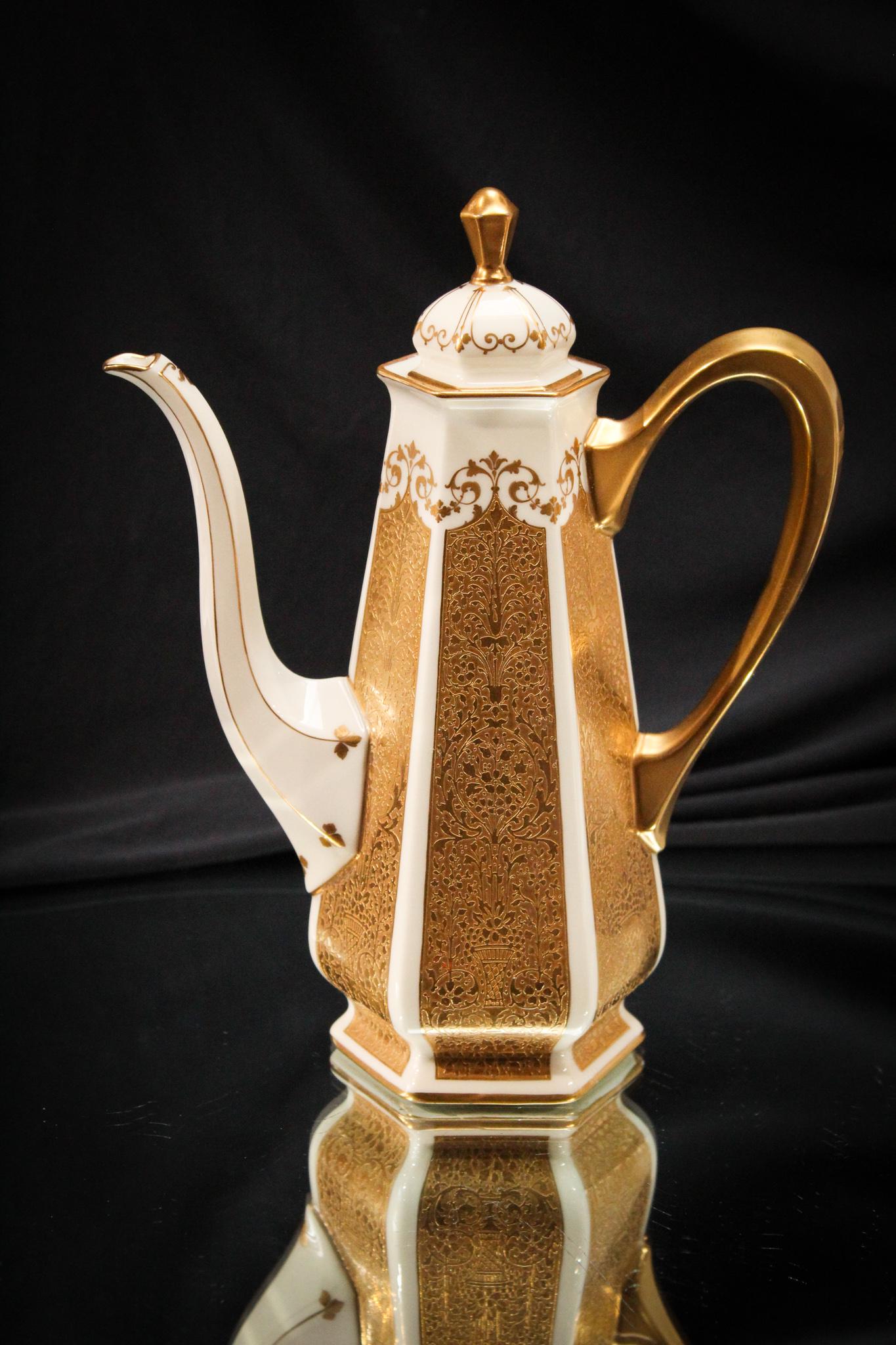 Lenox Porcelain Gilt decorated Tea Pot: This amazing piece was retailed by Baily, Banks, and Biddle. The amount of gold on this porcelain lovely is insane. Measures 9" tall.