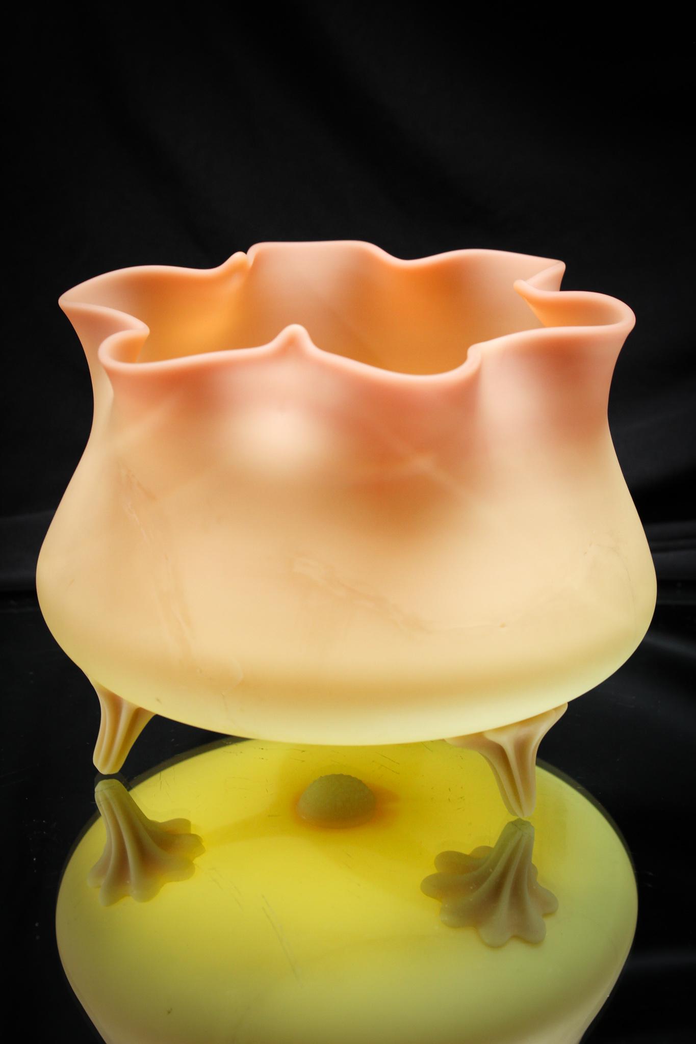 Mt. Washington Burmese Victorian Glass ftd Vase: Nice large example of Mt. Washington glass with applied feet. Super nice coloring. Want a showy piece for a fraction of the price? Here's your chance. Measures 5 3/4" tall.