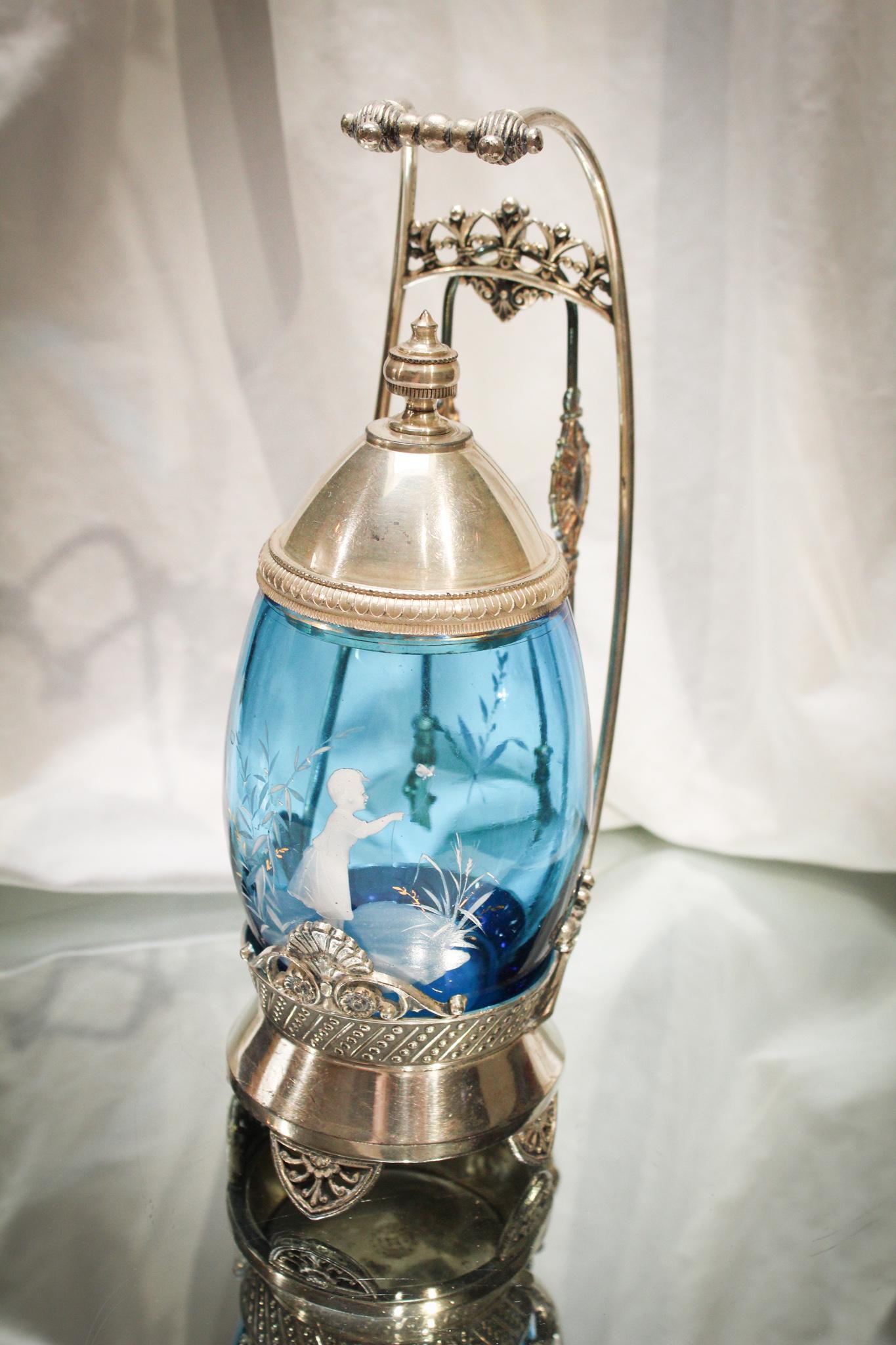 Blue Enameled Mary Gregory Tufts Silverplate Pickle Castor: Just one amazing piece after another isn't it? Yep. Sure is. This is a phenomenal Victorian Mary Gregory pickle castor complete in signed Tufts frame. Gorgeous! Measures 10" tall.