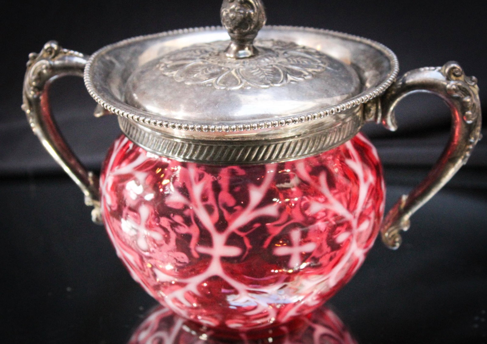 Northwood Cranberry Spanish Lace Silverplate Sugar Bowl: This pattern and color is always collectible. Add the ever popular Victorian silverplate to it and it kicks it up to a whole different level. We are happy to offer such a nice piece. Measures 5" tall